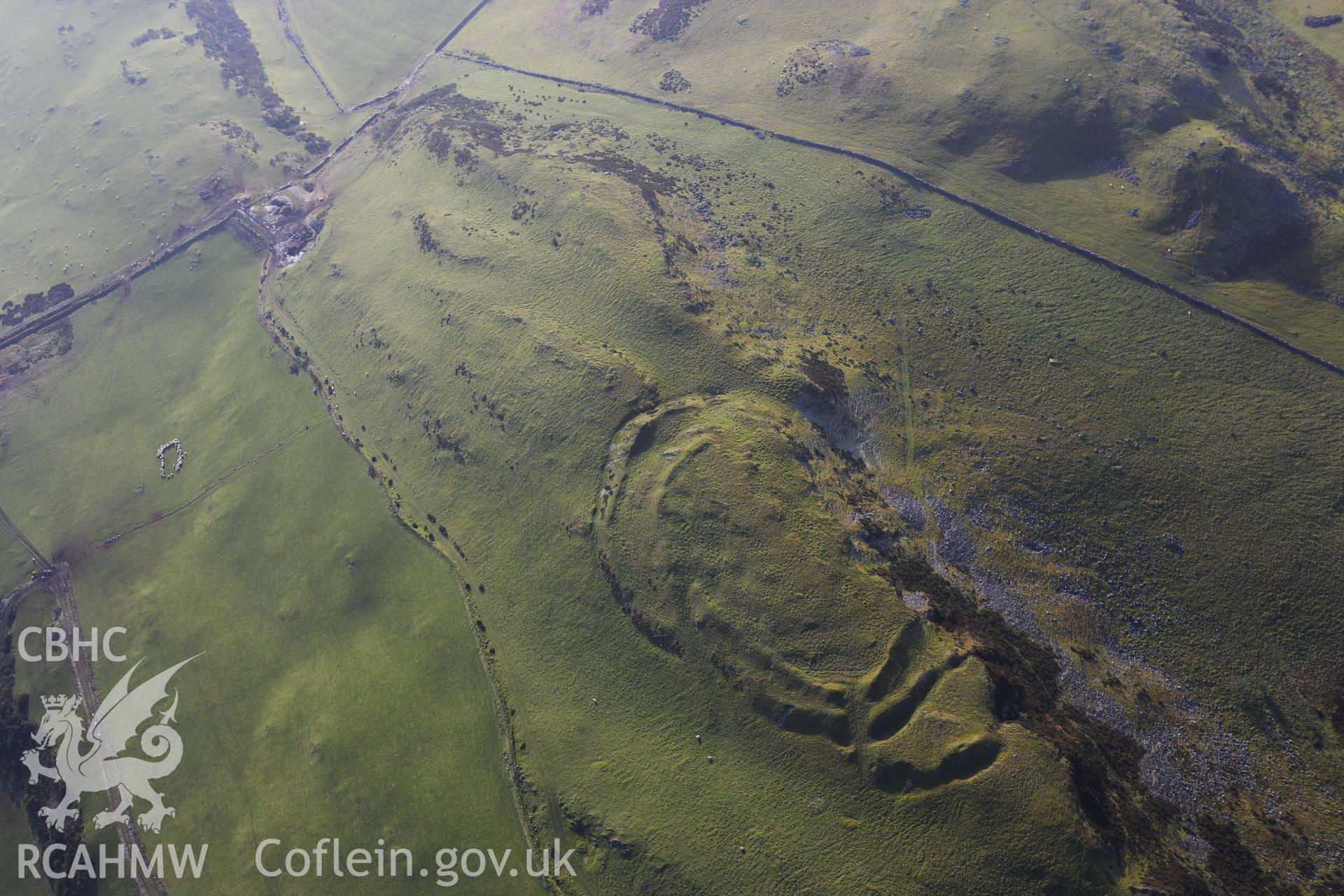 RCAHMW colour oblique photograph of Pen-Y-Ffrwyd Llwyd Hillfort. Taken by Toby Driver on 07/02/2012.