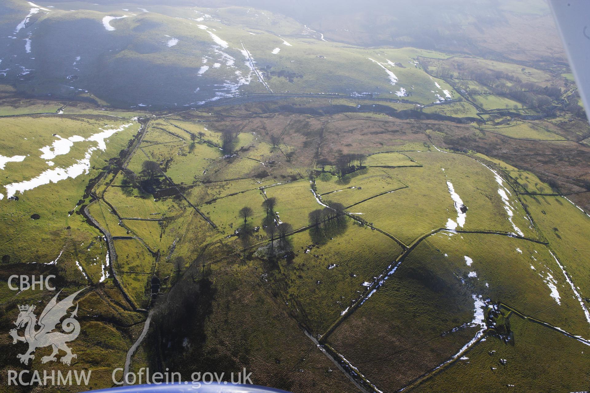 RCAHMW colour oblique photograph of Gwar Ffynnon, Deserted Famsteads. Taken by Toby Driver on 07/02/2012.