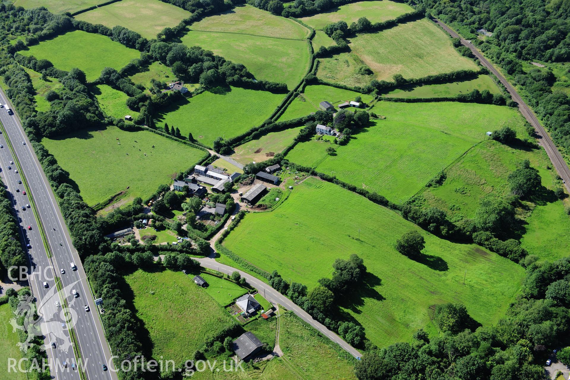 RCAHMW colour oblique photograph of Miskin Roman Fort. Taken by Toby Driver on 24/07/2012.