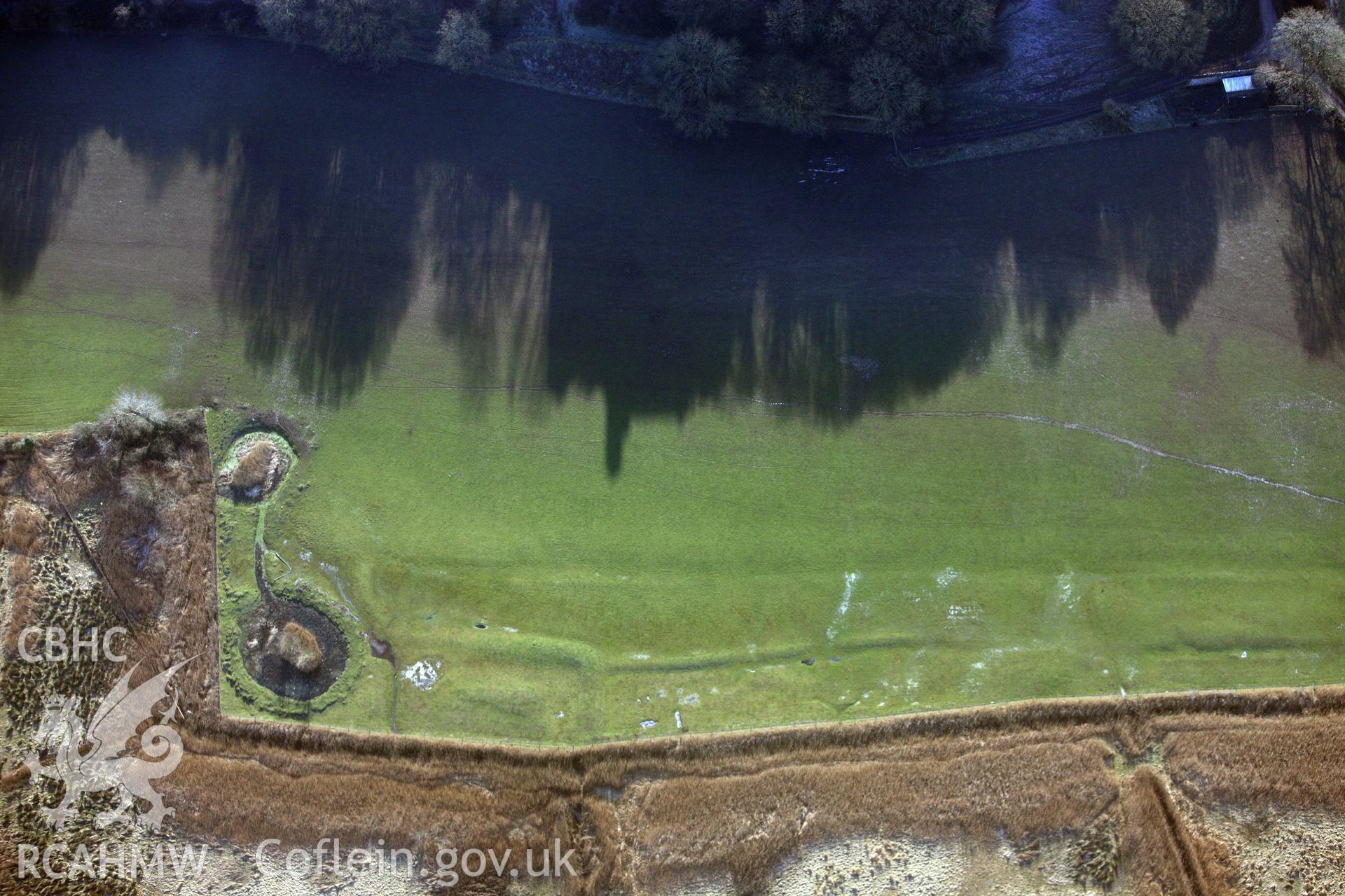 RCAHMW colour oblique photograph of Woebly Castle, Earthworks West Of Castle. Taken by Toby Driver on 02/02/2012.