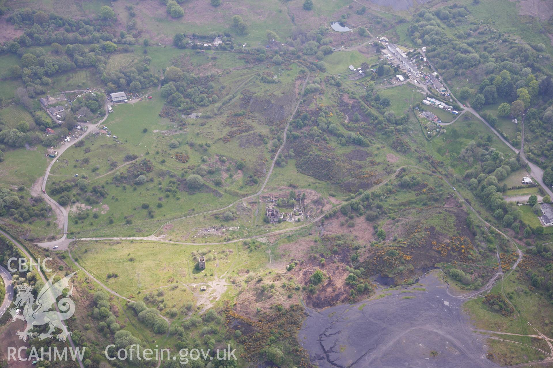 RCAHMW colour oblique photograph of British Ironworks, view from north with spoil tips. Taken by Toby Driver on 22/05/2012.