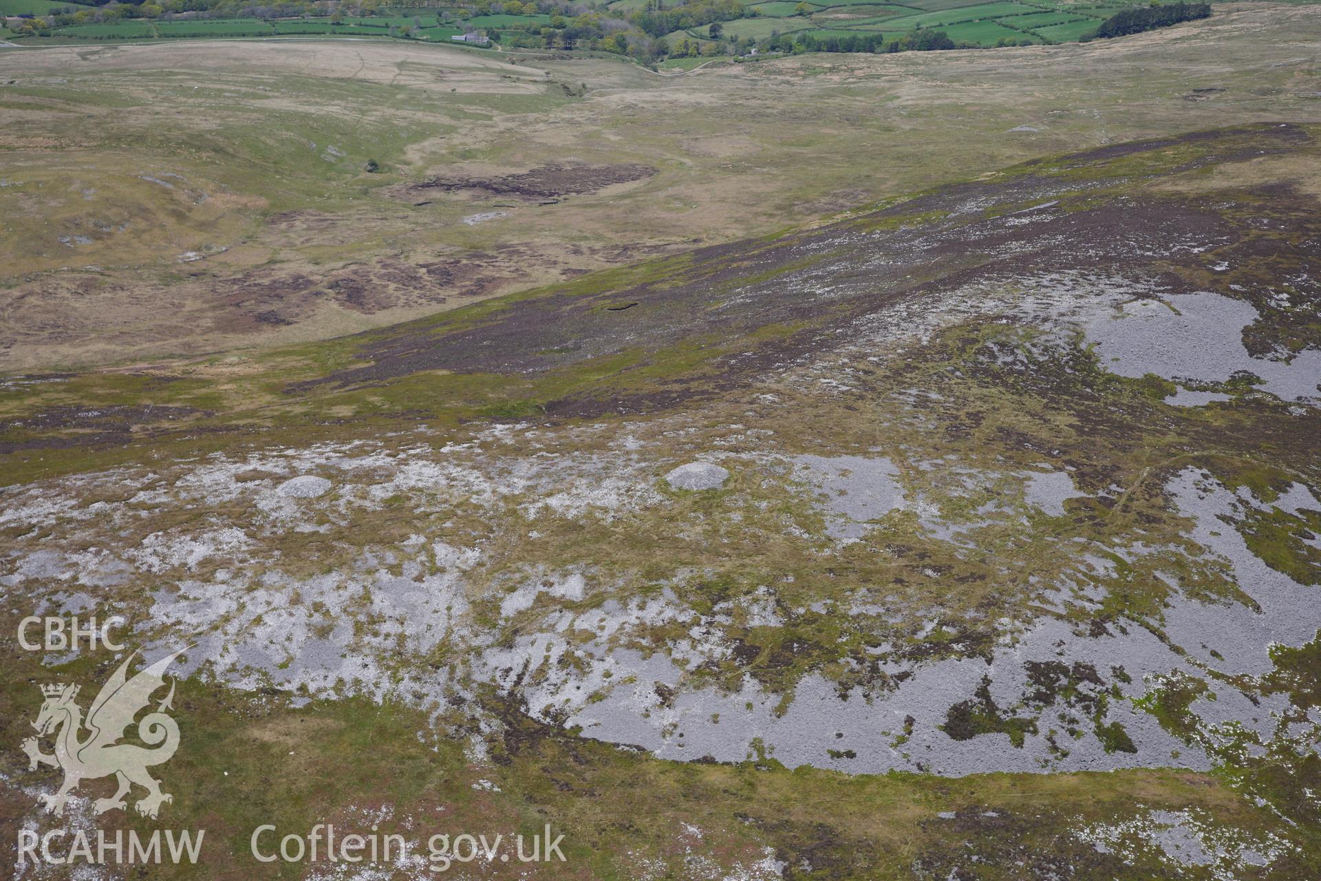 RCAHMW colour oblique photograph of Tair Carn Uchaf cairns, view from south. Taken by Toby Driver on 22/05/2012.