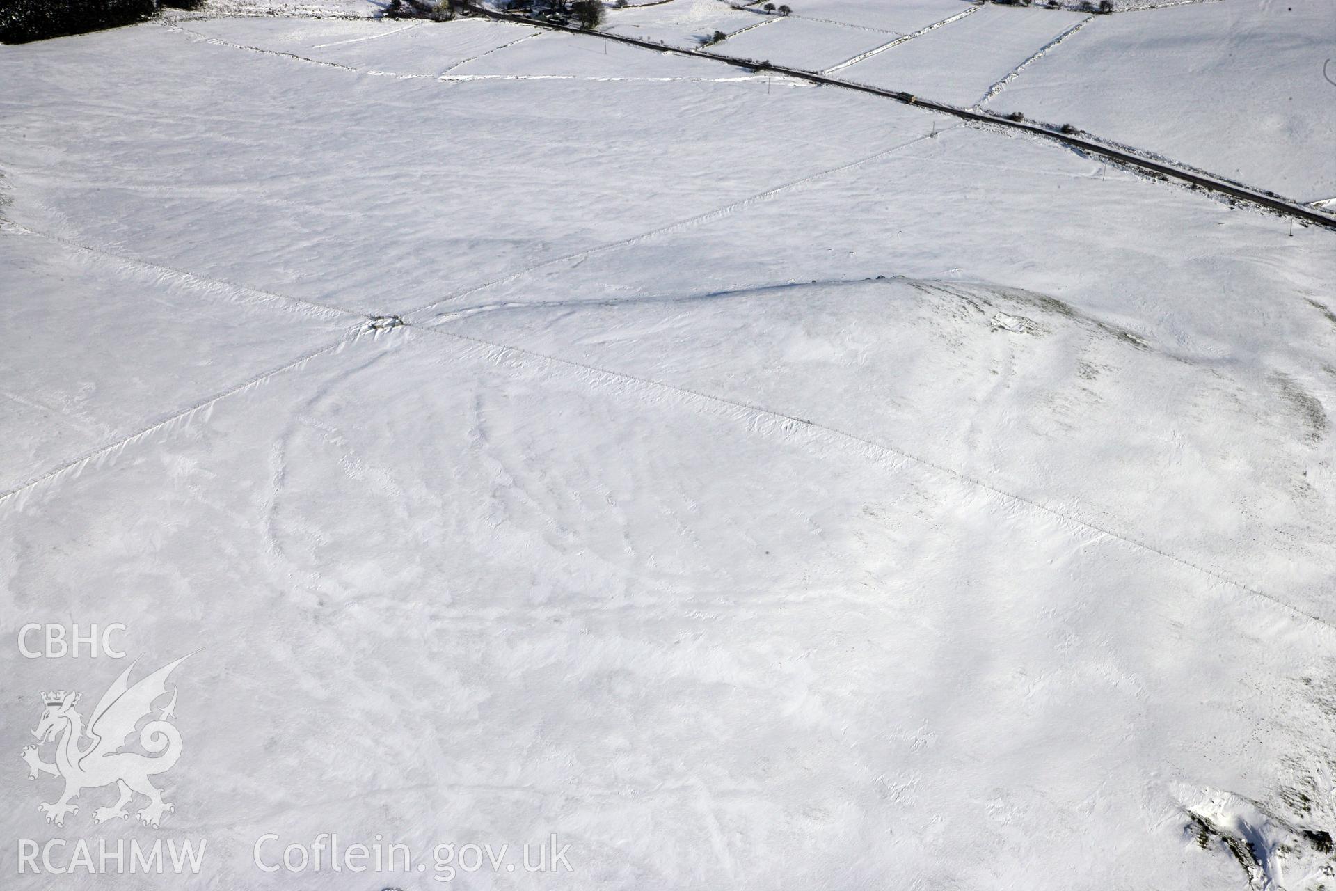 RCAHMW colour oblique photograph of Banc Du Neolithic Enclosure. Taken by Toby Driver on 02/02/2012.