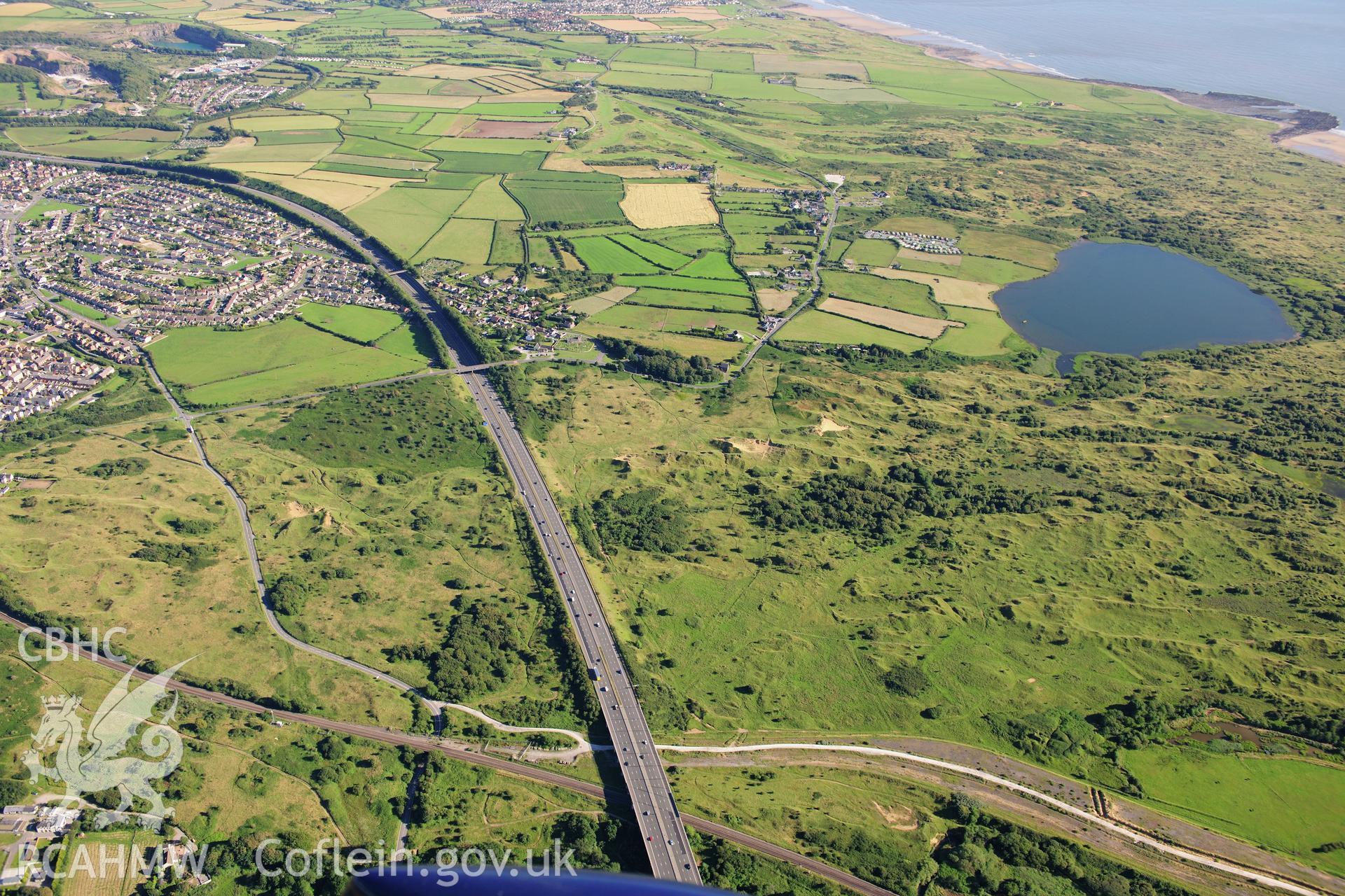 RCAHMW colour oblique photograph of Kenfig Medieval Borough. Taken by Toby Driver on 24/07/2012.