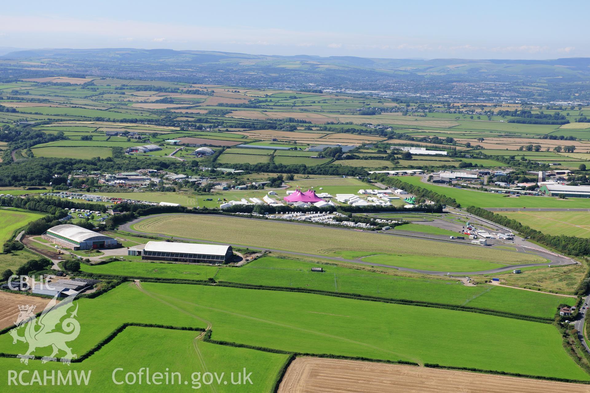 RCAHMW colour oblique photograph of Llandow Airfield, site of the 2012 National Eisteddfod of Wales. Taken by Toby Driver on 24/07/2012.