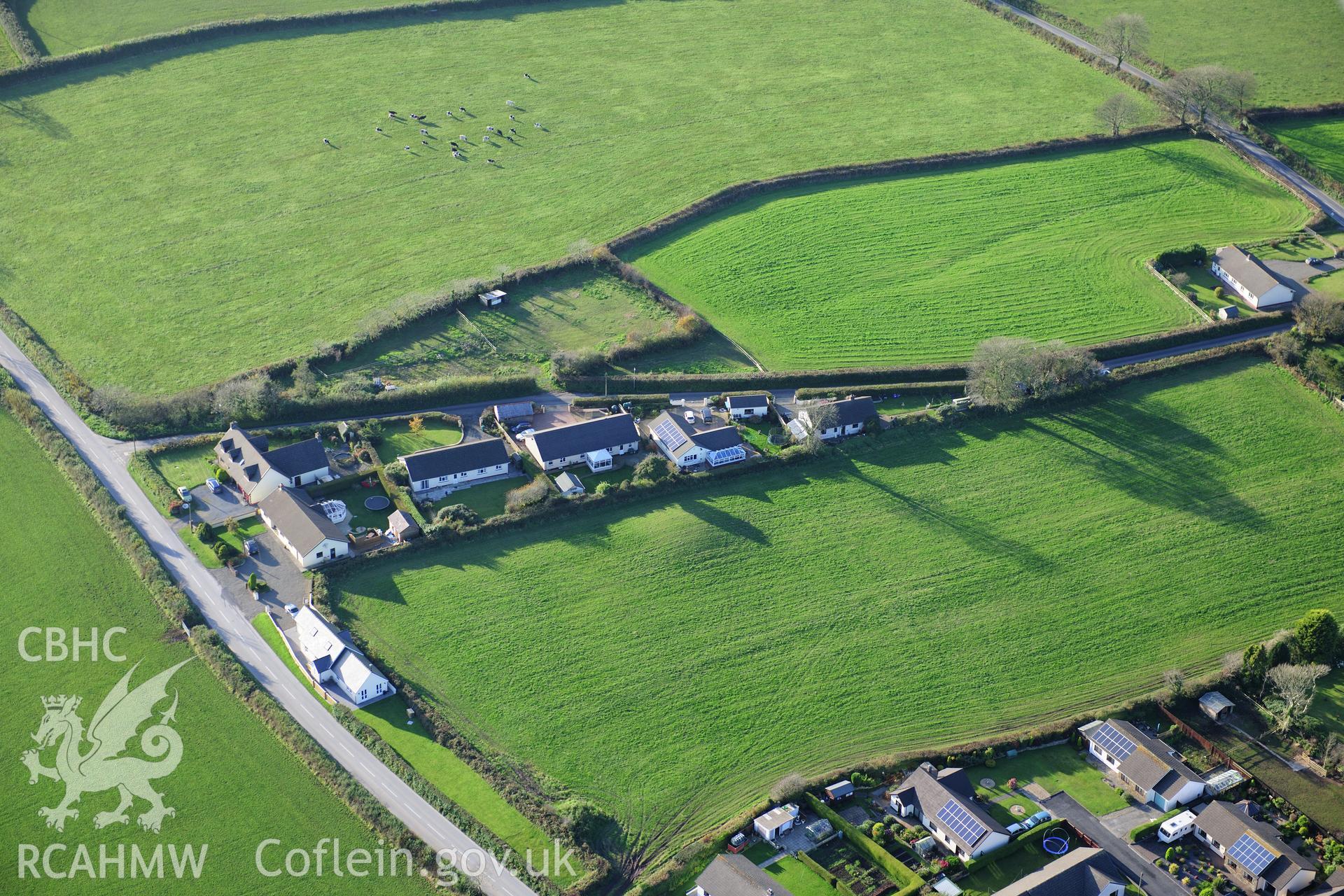 RCAHMW colour oblique photograph of Crug Swllt Round Barrow, Tavernspite. Taken by Toby Driver on 26/10/2012.