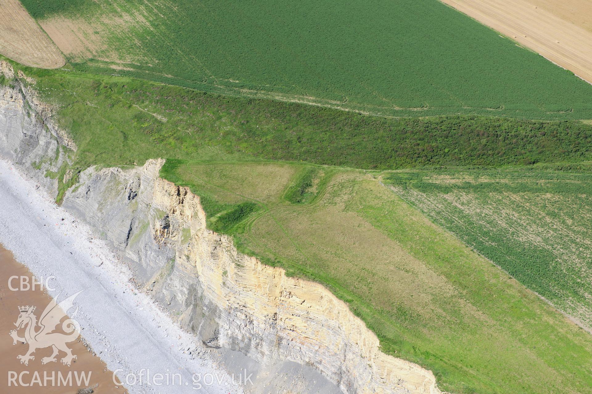 RCAHMW colour oblique photograph of Cwm Bach Camps, with cliff erosion. Taken by Toby Driver on 24/07/2012.