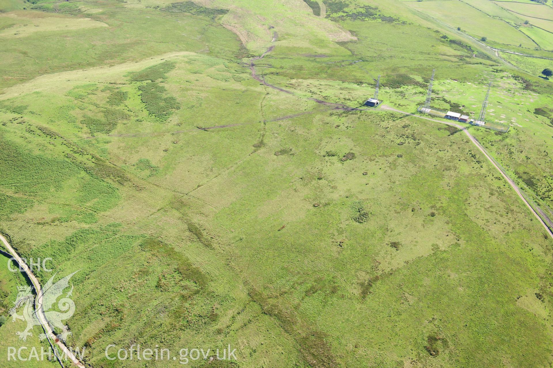 RCAHMW colour oblique photograph of Cross Ridge Dyke and Cairn on Tywn Hywel. Taken by Toby Driver on 24/07/2012.