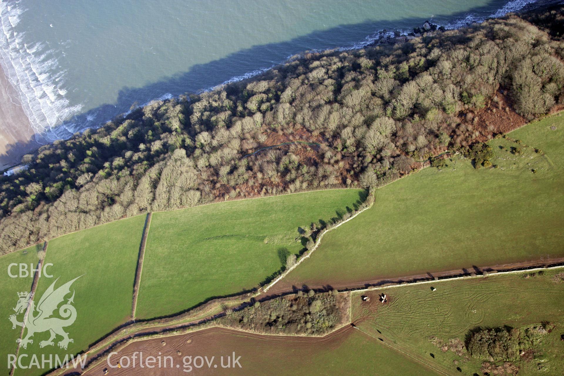 RCAHMW colour oblique photograph of S-E of St Illtud's Church, Oxwich. Taken by Toby Driver on 02/02/2012.