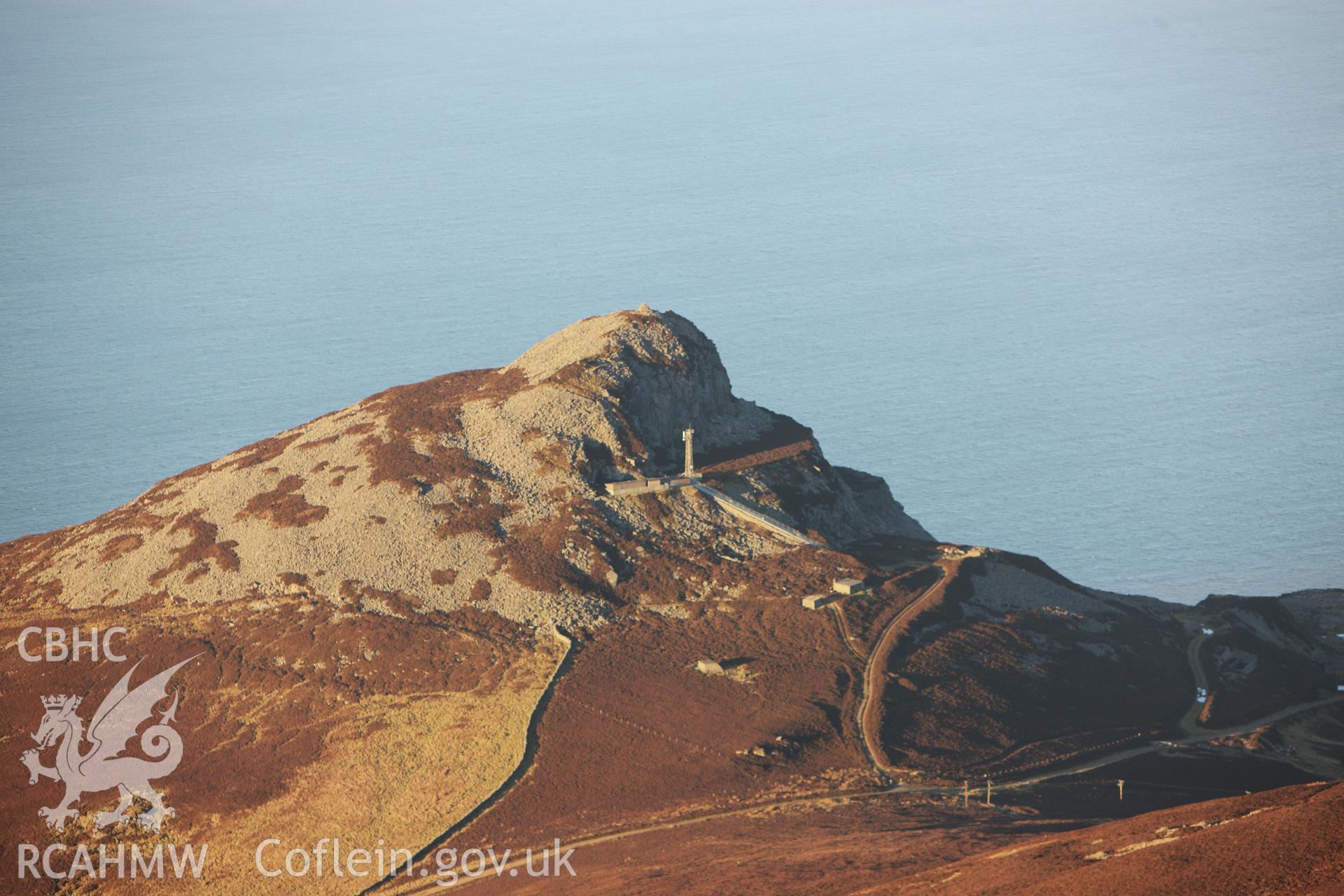 RCAHMW colour oblique photograph of Cairn on north-west summit of Yr Eifl, and quarries. Taken by Toby Driver on 10/12/2012.