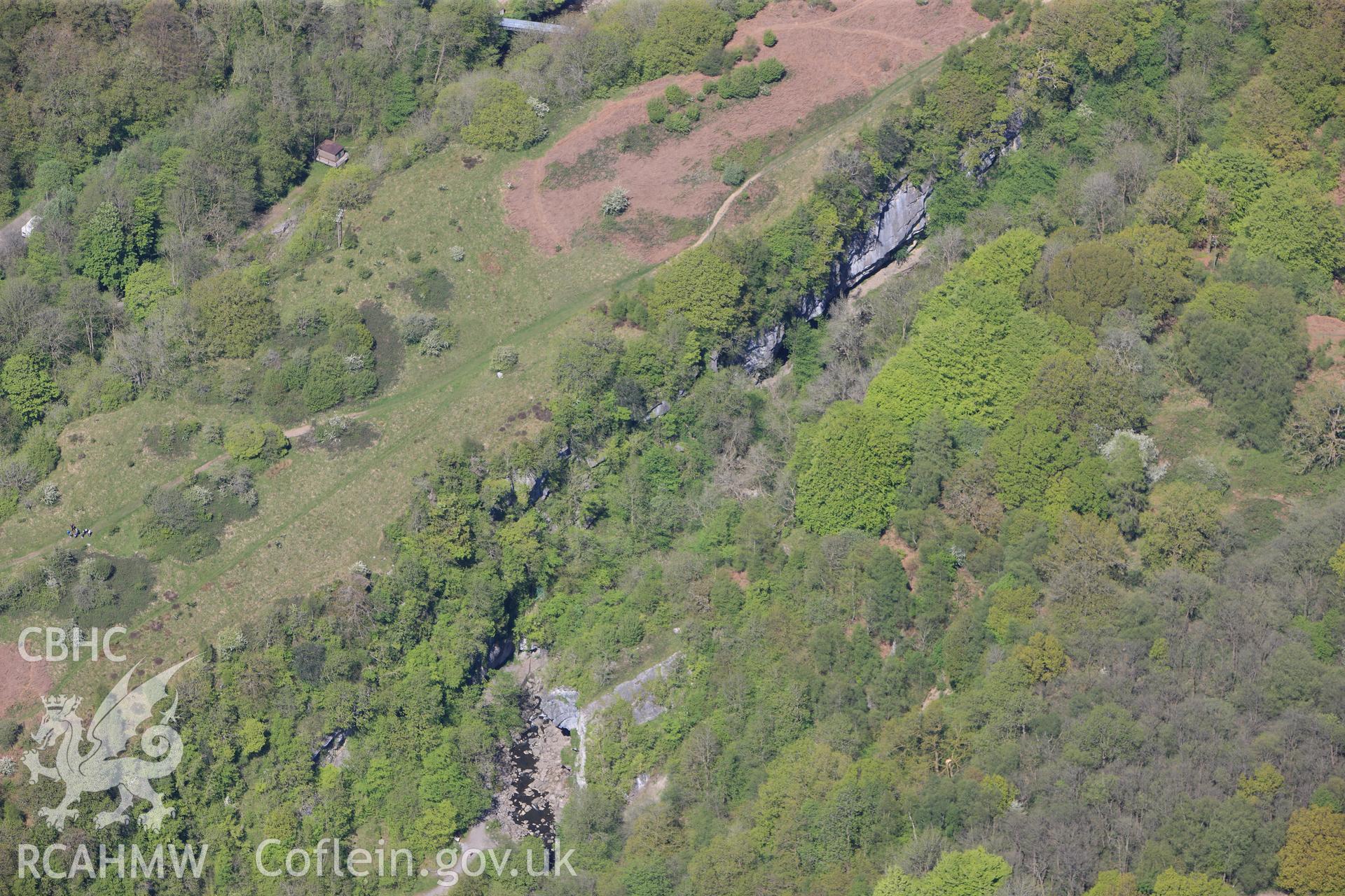 RCAHMW colour oblique photograph of Craig y Ddinas promontory fort, and Black Powder works, from south-west. Taken by Toby Driver on 22/05/2012.