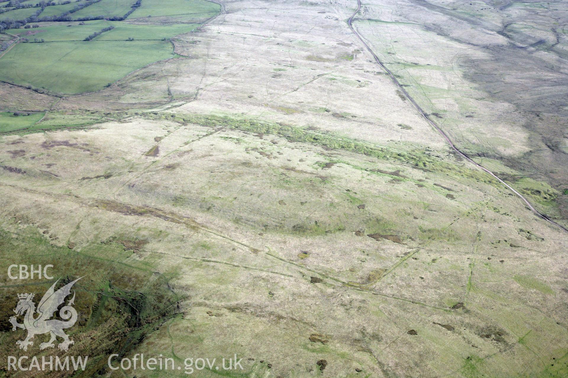 RCAHMW colour oblique photograph of Y Pigwn Roman marching camps. Taken by Toby Driver and Oliver Davies on 28/03/2012.