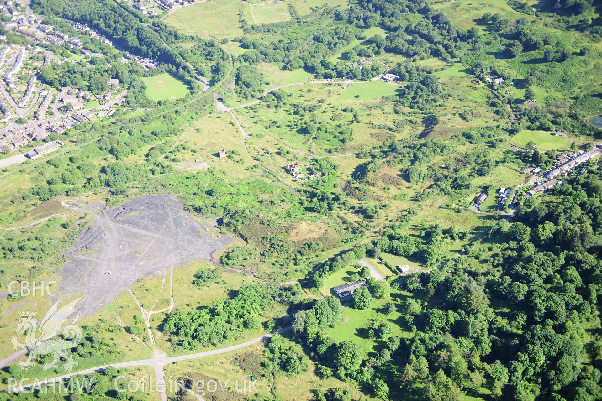 RCAHMW colour oblique photograph of British Ironworks, general view. Taken by Toby Driver on 24/07/2012.