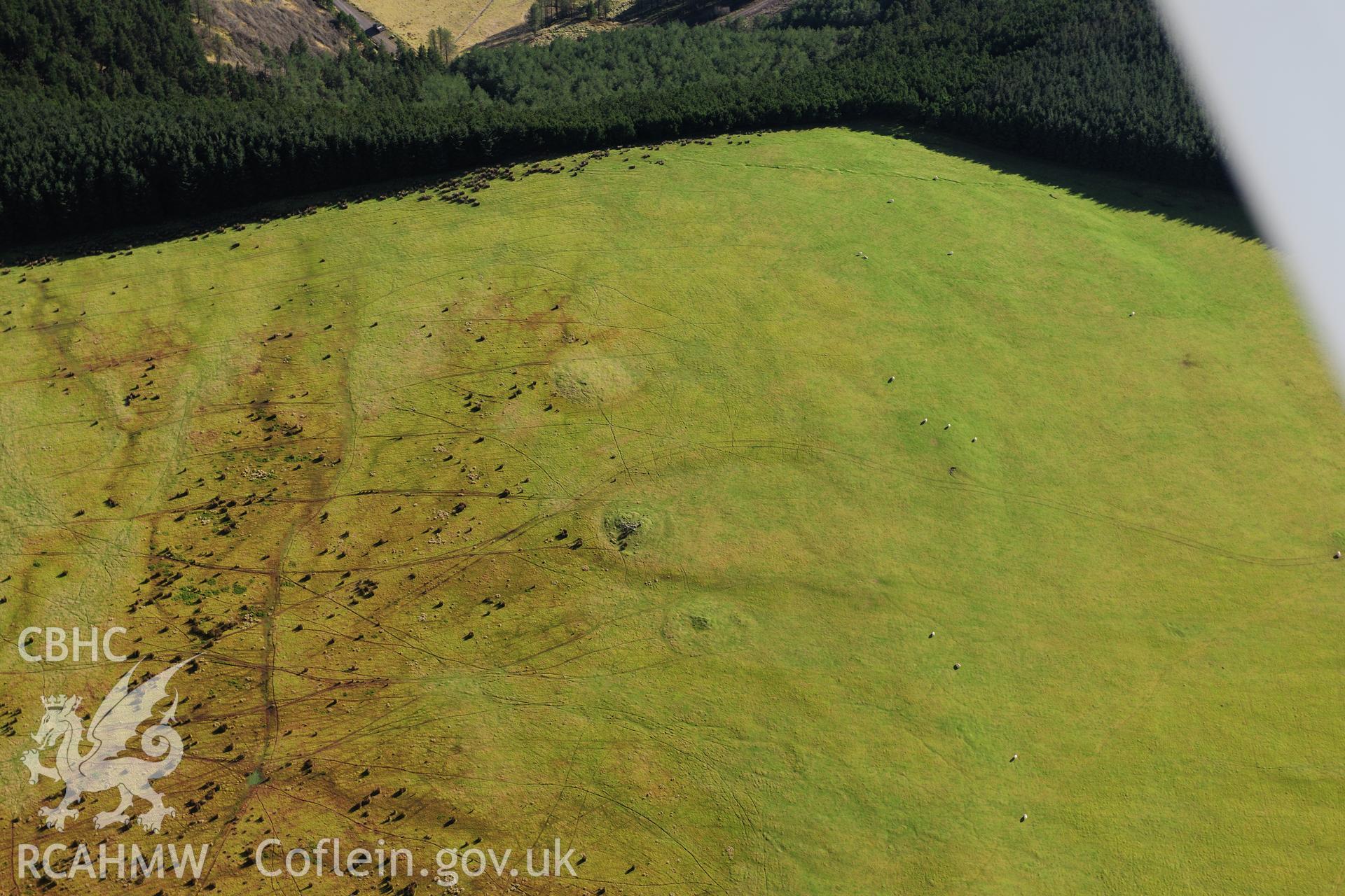 RCAHMW colour oblique photograph of Mynydd Caerau round cairns. Taken by Toby Driver on 28/11/2012.