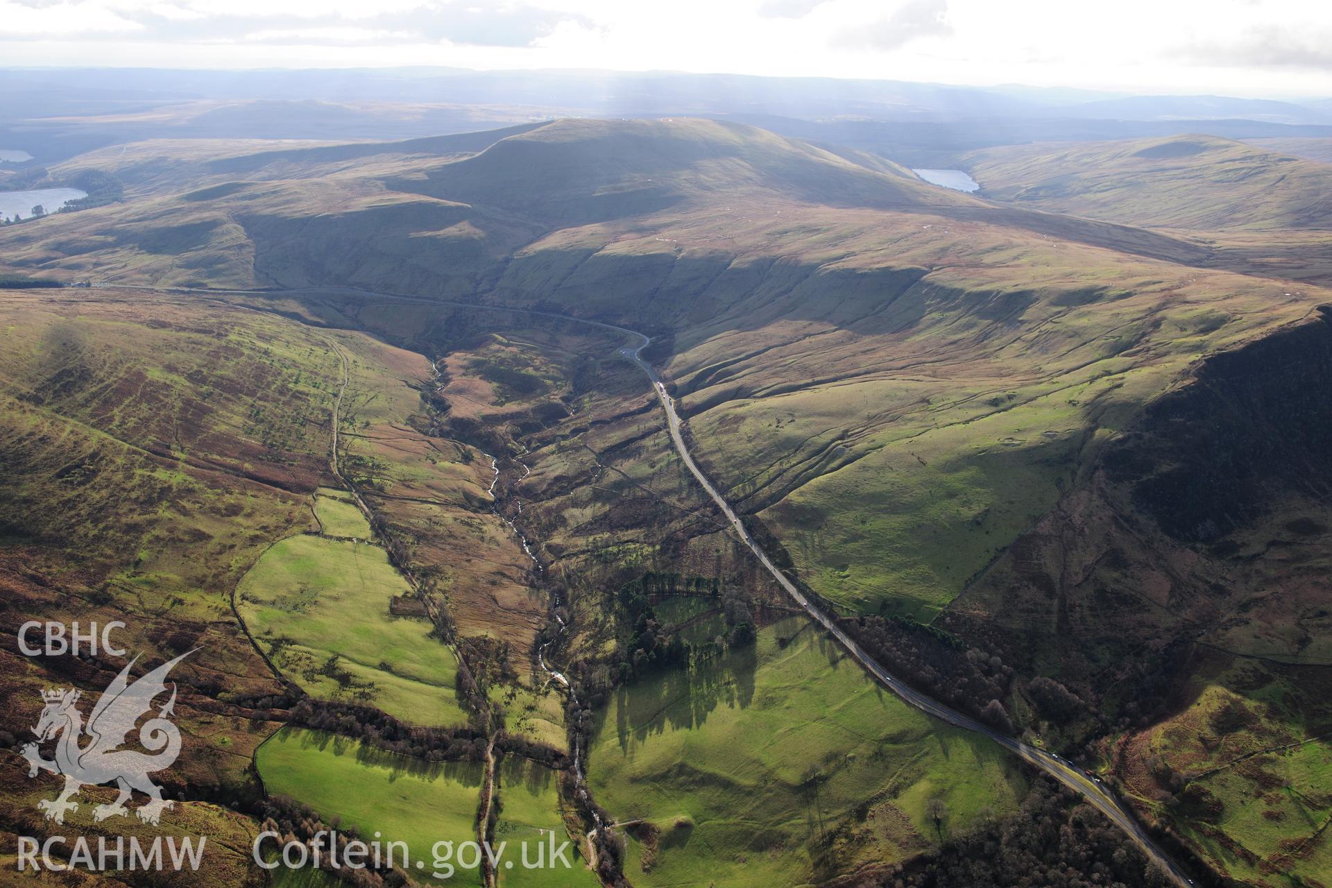 RCAHMW colour oblique photograph of Blaen Glyn round cairn, and field system, landscape view. Taken by Toby Driver on 28/11/2012.