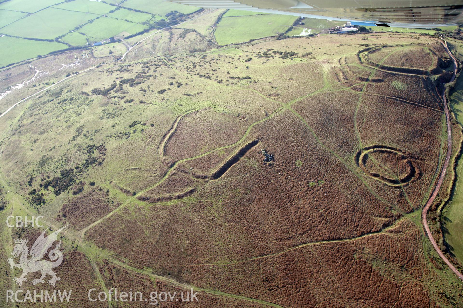 RCAHMW colour oblique photograph of Three Camps On Hardings Down. Taken by Toby Driver on 02/02/2012.