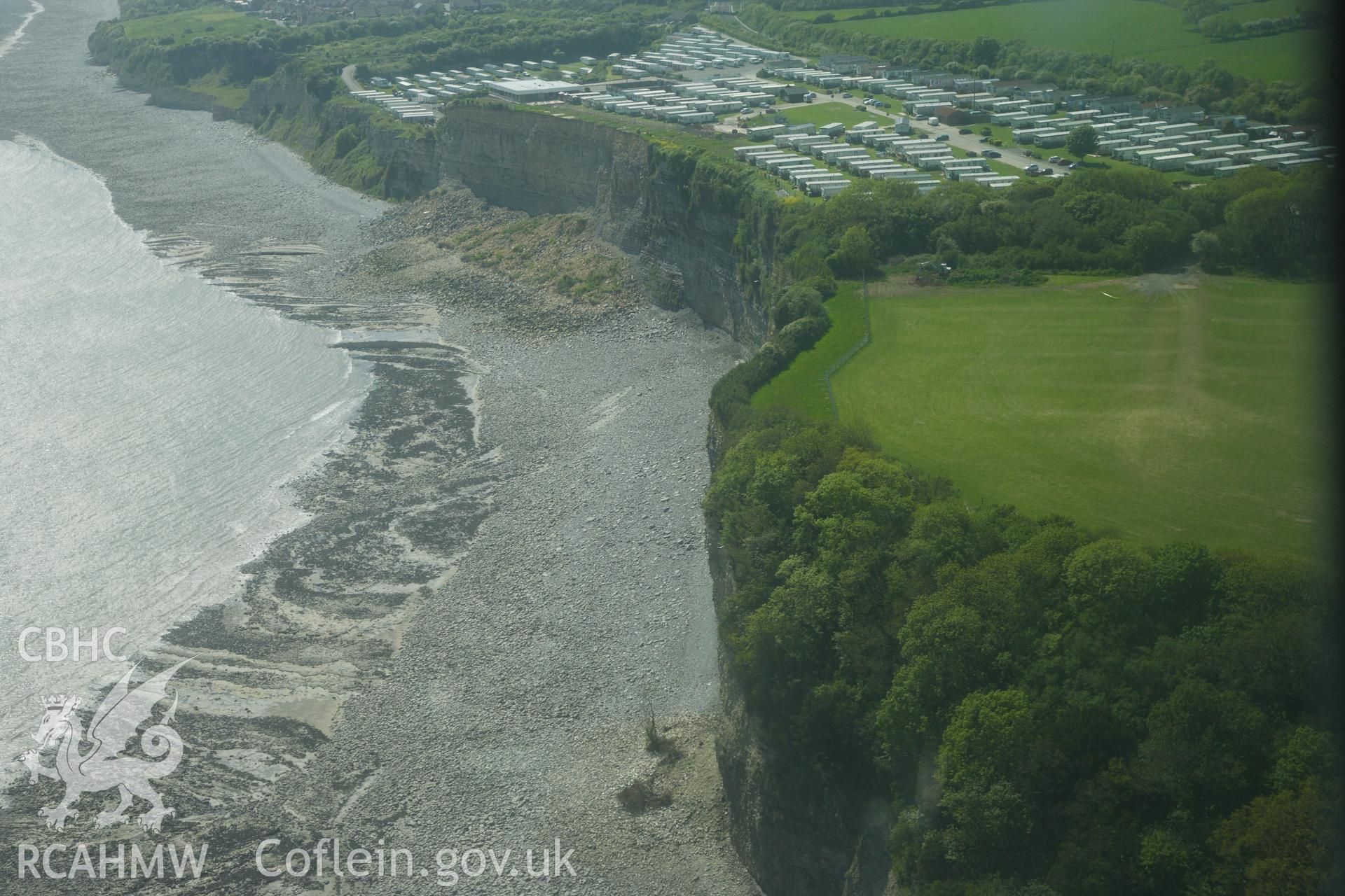 RCAHMW colour oblique photograph of The Bulwarks Camp, with recent cliff collapse at Porthkerry Caravan Park. Taken by Toby Driver on 22/05/2012.