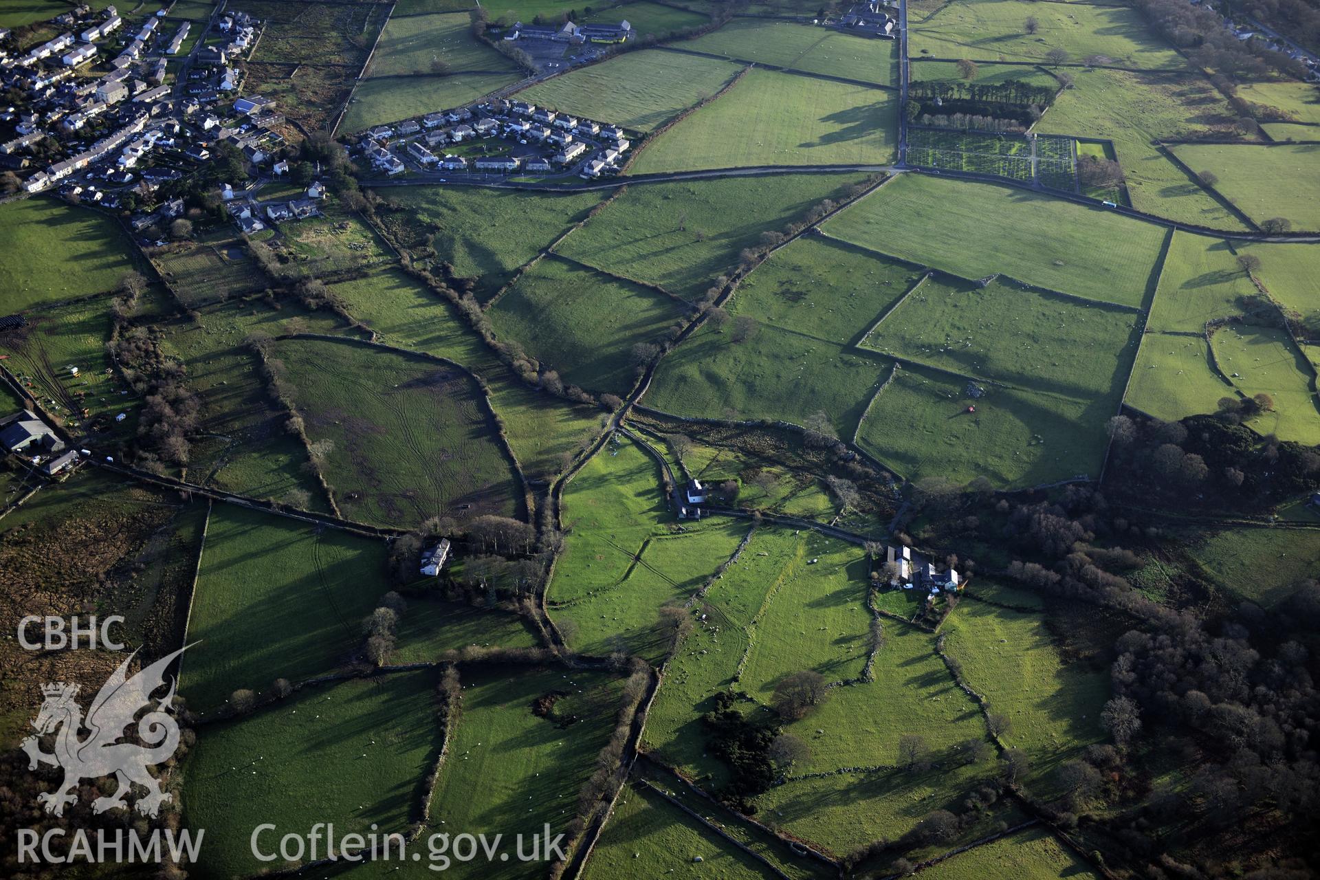 RCAHMW colour oblique photograph of Coed Uchaf Hut Group. Taken by Toby Driver on 10/12/2012.