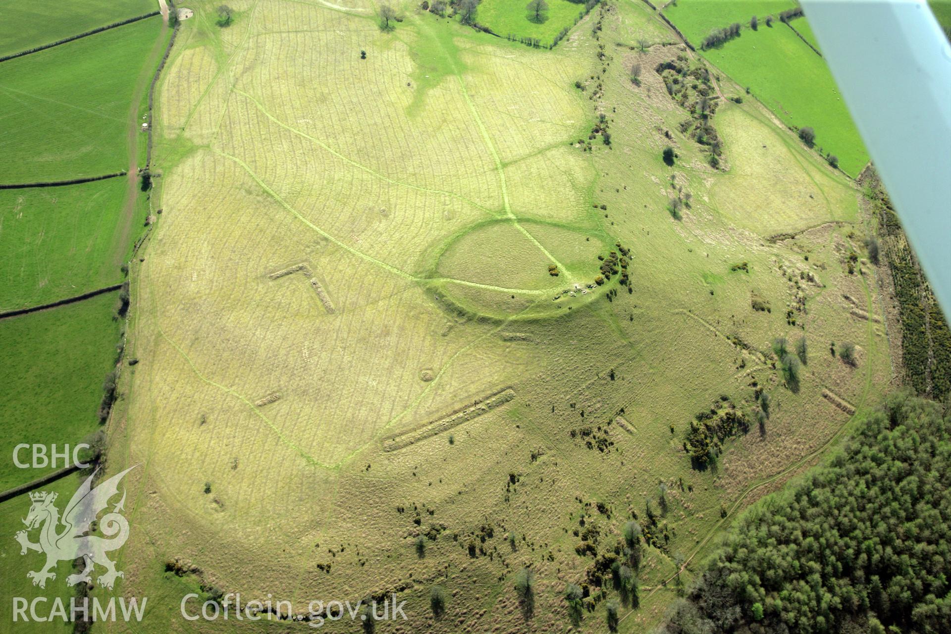 RCAHMW colour oblique photograph of Twyn y Gaer hillfort, and pillow mounds. Taken by Toby Driver and Oliver Davies on 28/03/2012.