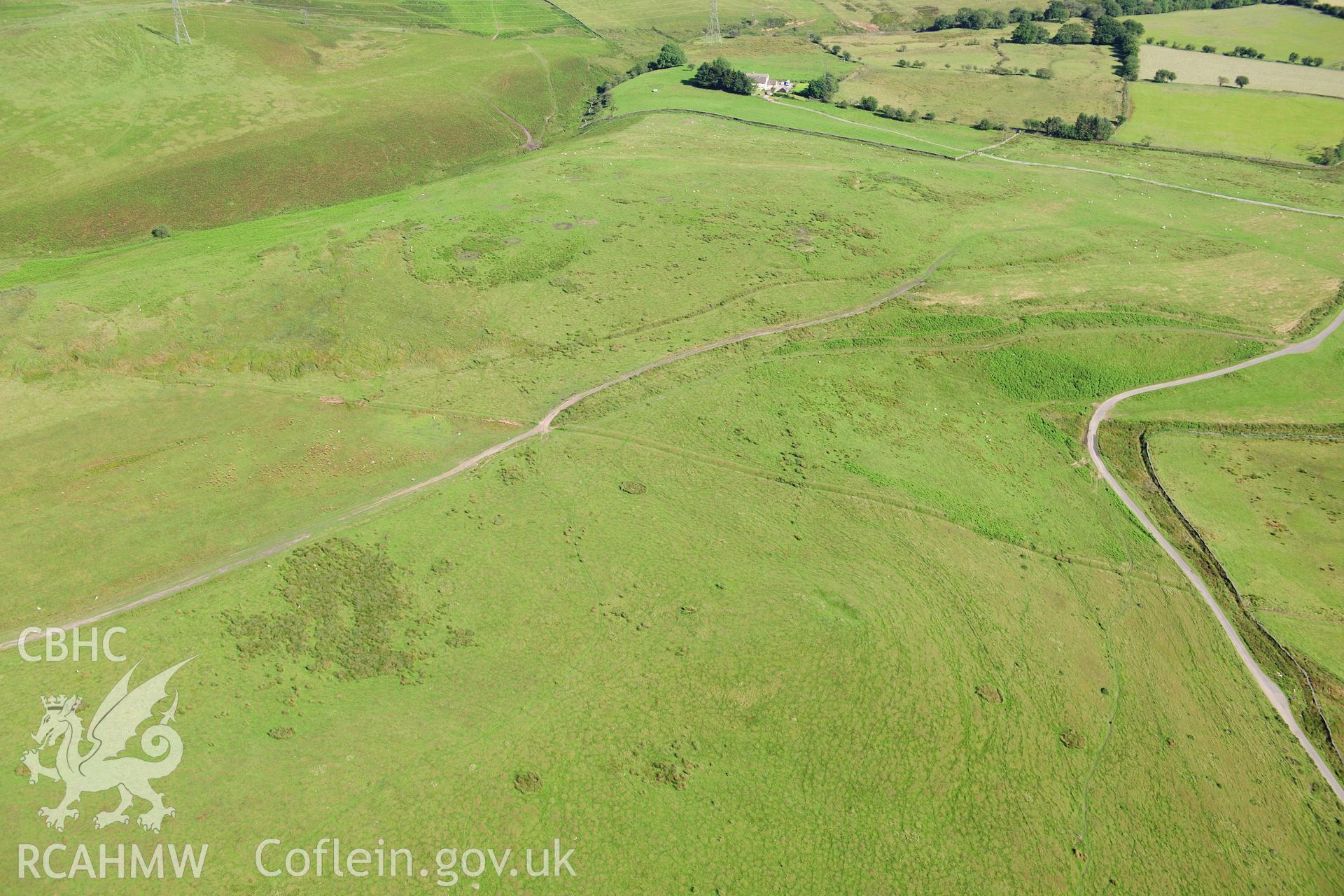 RCAHMW colour oblique photograph of Mynydd Eglwysilian, dyke and earthwork. Taken by Toby Driver on 24/07/2012.