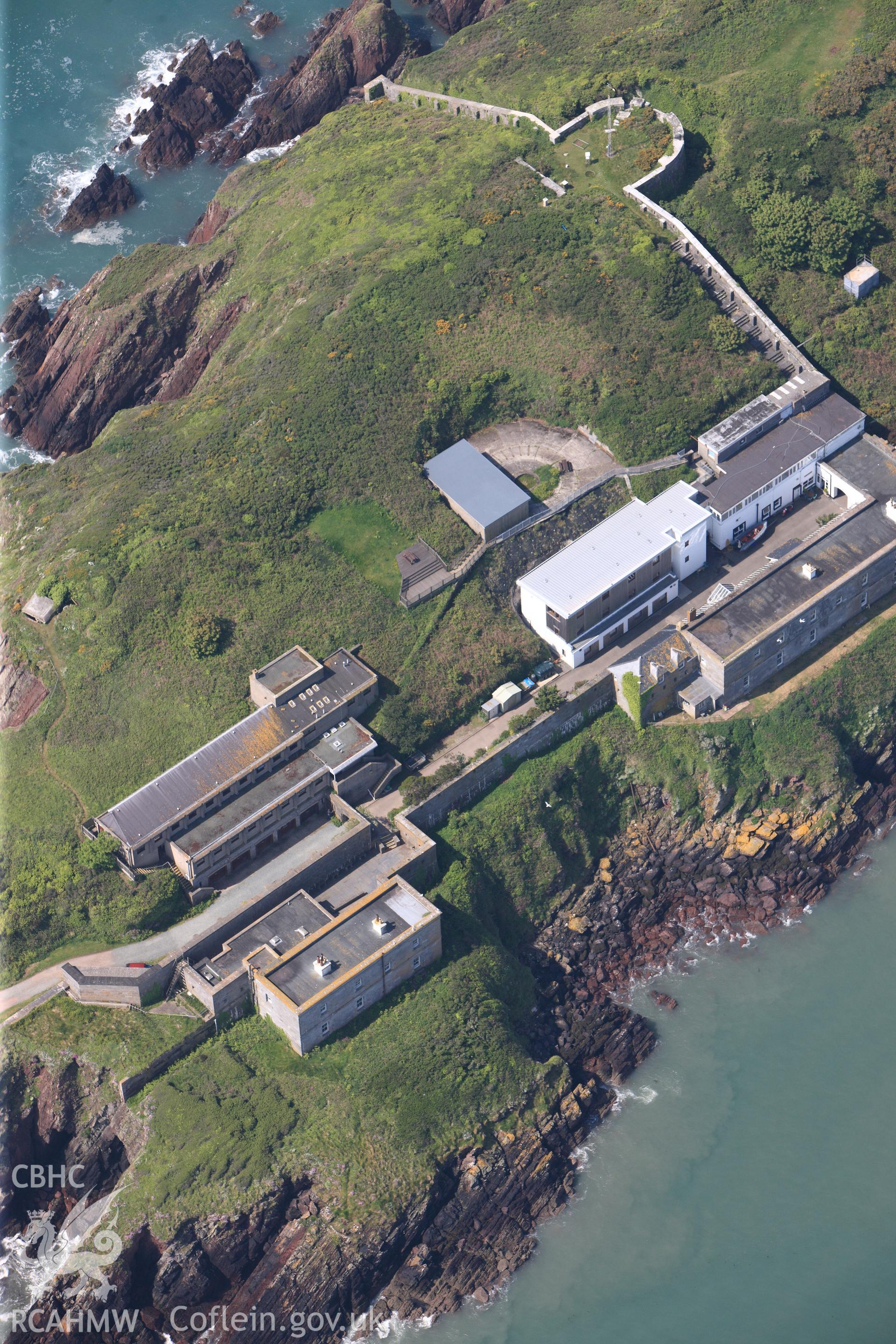 RCAHMW colour oblique photograph of General view of Dale Point promontory fort, looking north east. Taken by Toby Driver on 24/05/2012.