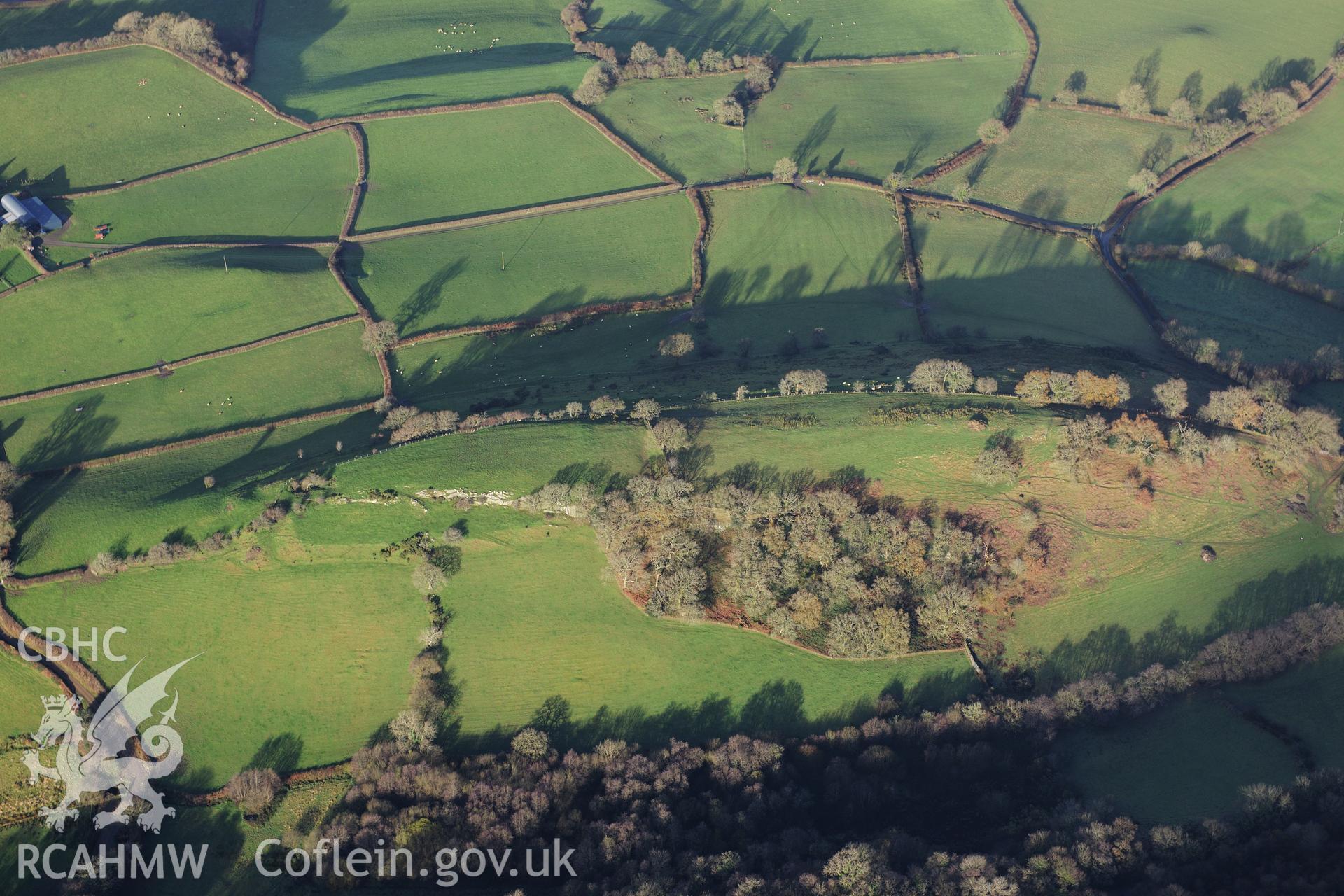 RCAHMW colour oblique photograph of Llwyndu Camp, hillfort, in low winter light. Taken by Toby Driver on 23/11/2012.