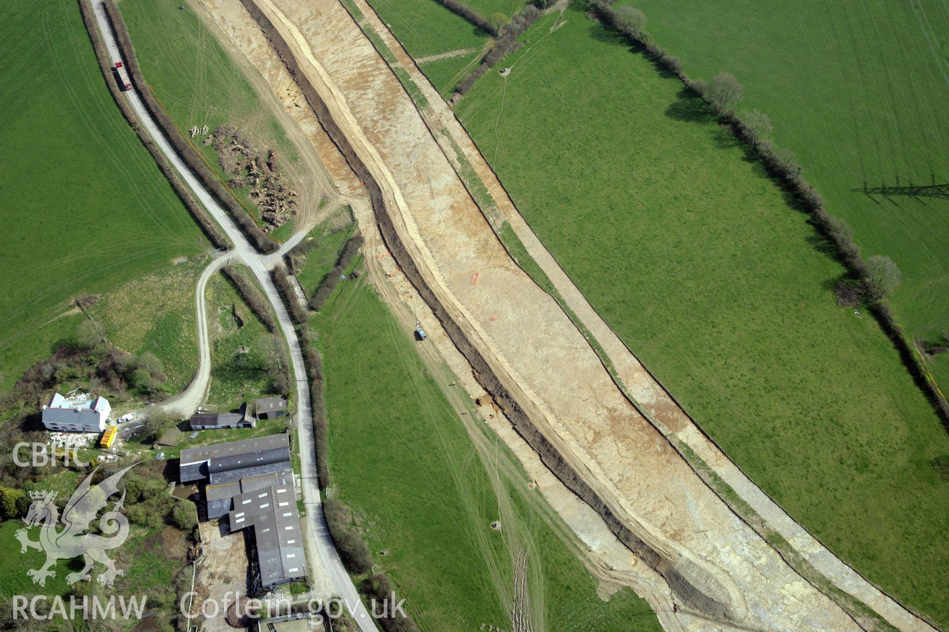 RCAHMW colour oblique photograph of A477 Bypass, at Pentrehowell. Archaeological excavations in progress. Taken by Toby Driver and Oliver Davies on 28/03/2012.