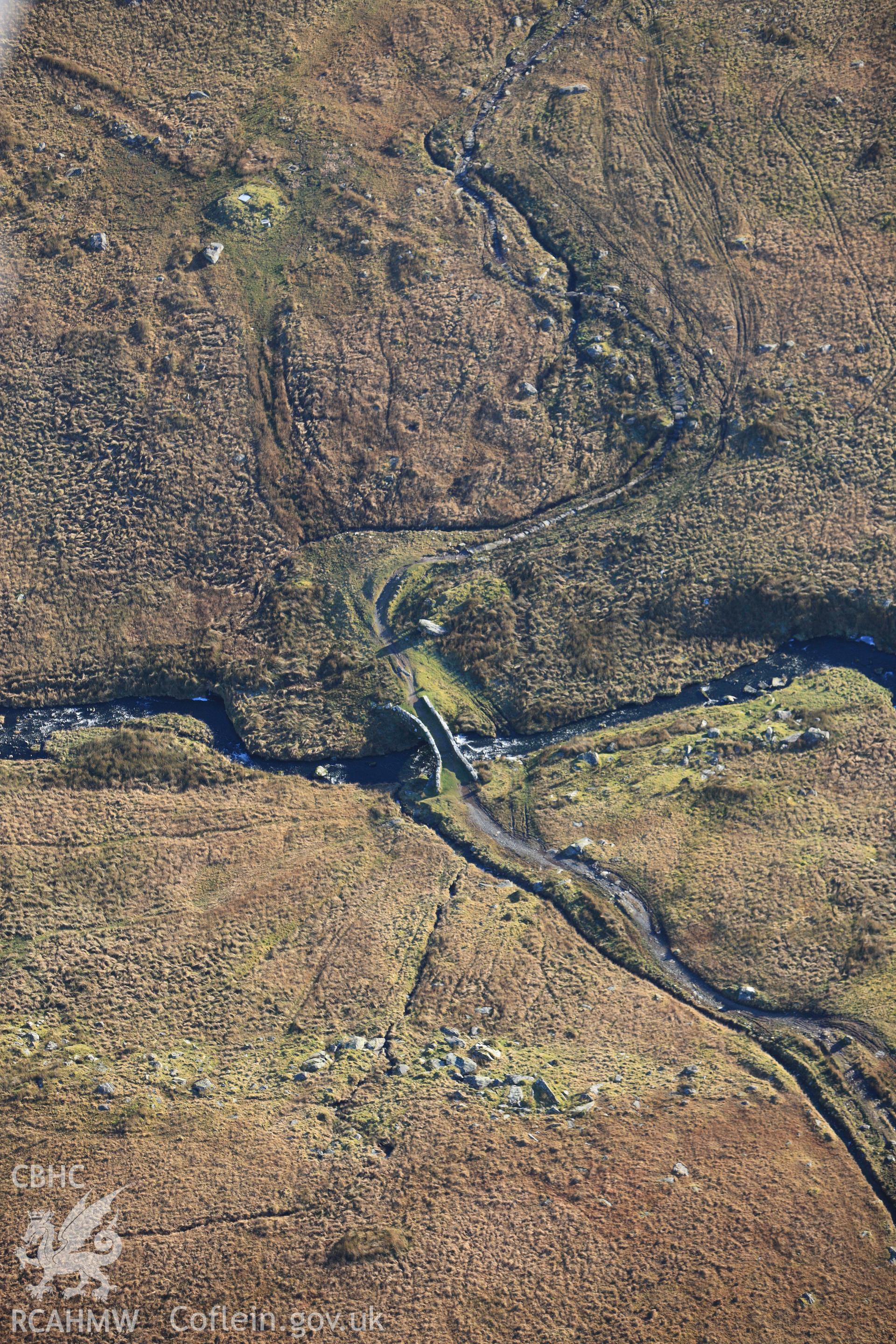 RCAHMW colour oblique photograph of Pont Scethin, packhorse bridge, in landscape. Taken by Toby Driver on 10/12/2012.