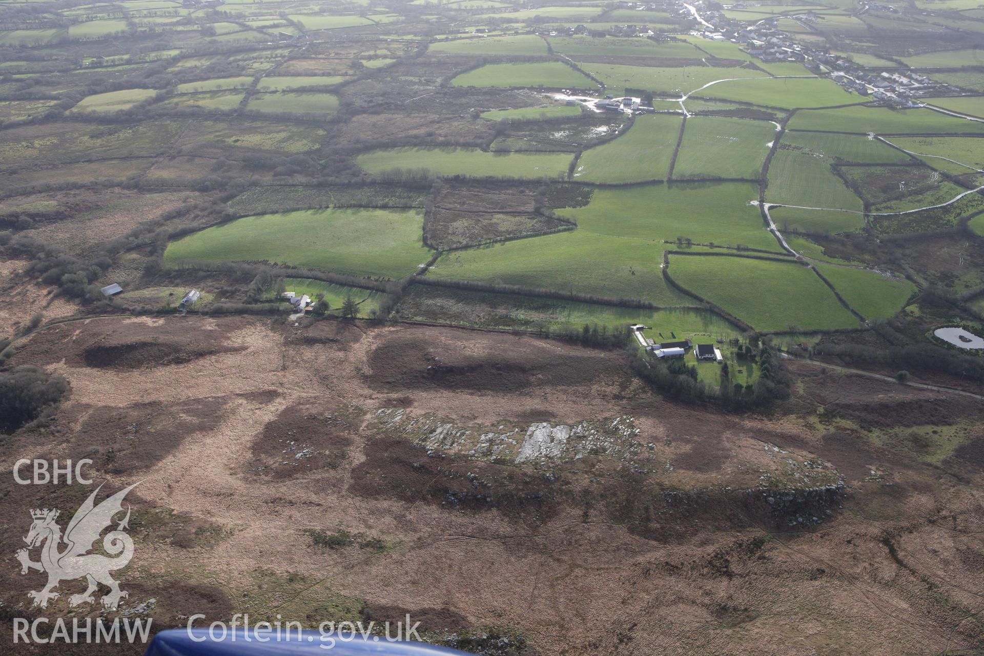 RCAHMW colour oblique photograph of Mynydd Llangyndeyrn, Burial Chambers. Taken by Toby Driver on 27/01/2012.