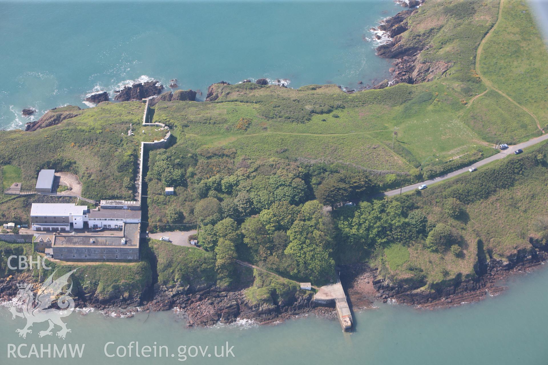 RCAHMW colour oblique photograph of General view of Dale Point promontory fort, looking west. Taken by Toby Driver on 24/05/2012.