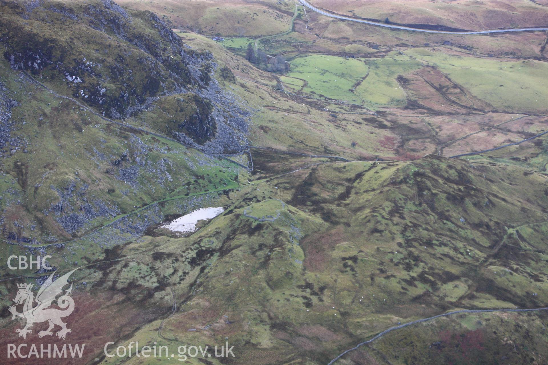 RCAHMW colour oblique photograph of Bryn y Castell hillfort. Taken by Toby Driver on 13/01/2012.