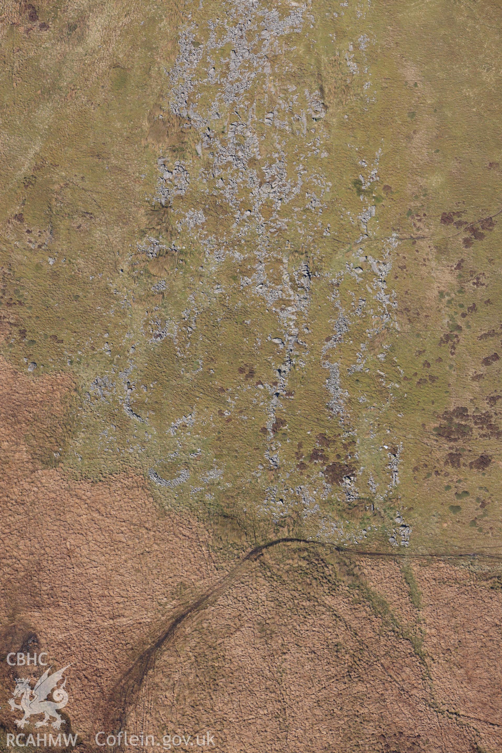 RCAHMW colour oblique photograph of Hut circle settlement below Foel Isaf. Taken by Toby Driver on 05/11/2012.