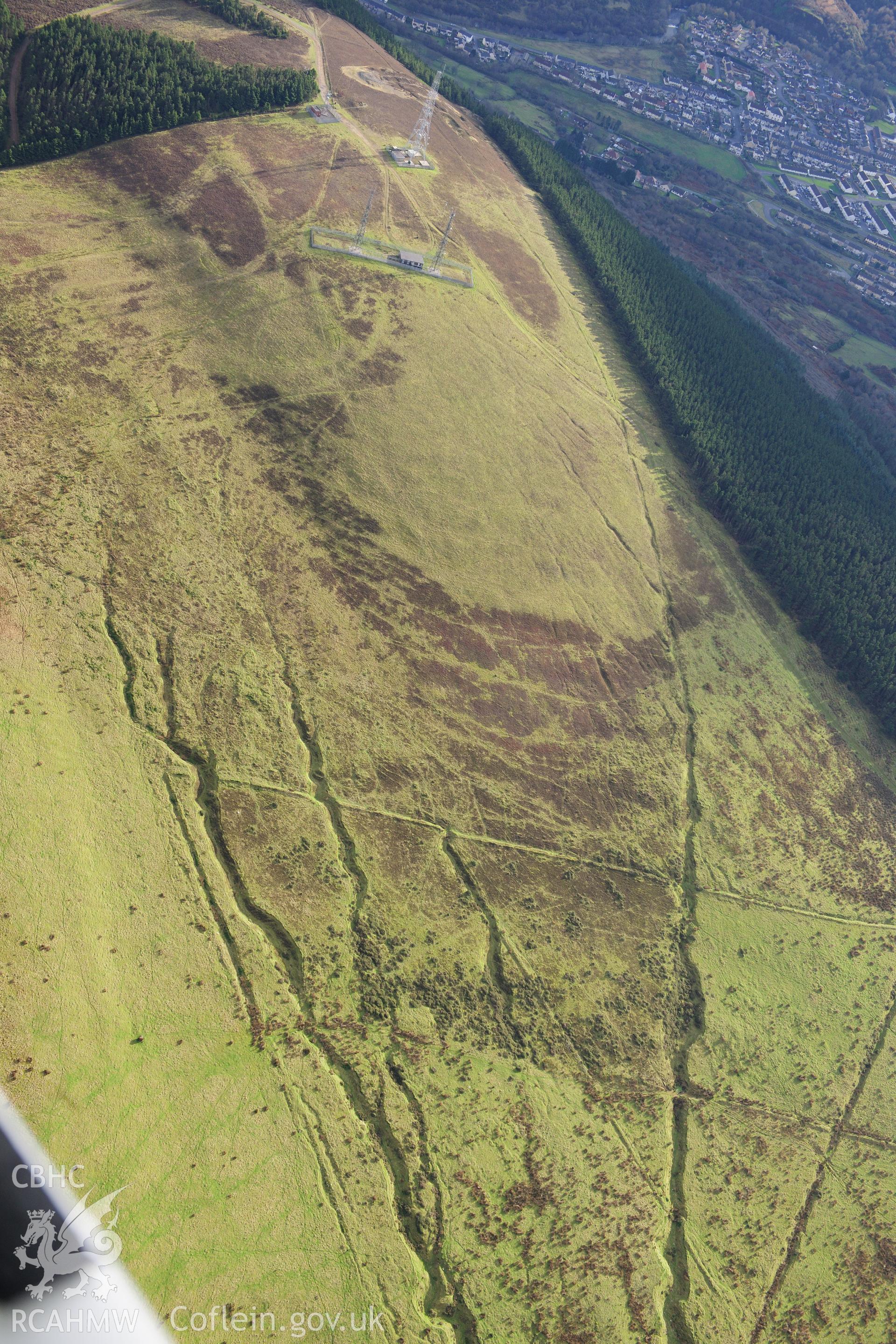 RCAHMW colour oblique photograph of Cwmafan Copper Works, opencast workings to west. Taken by Toby Driver on 28/11/2012.