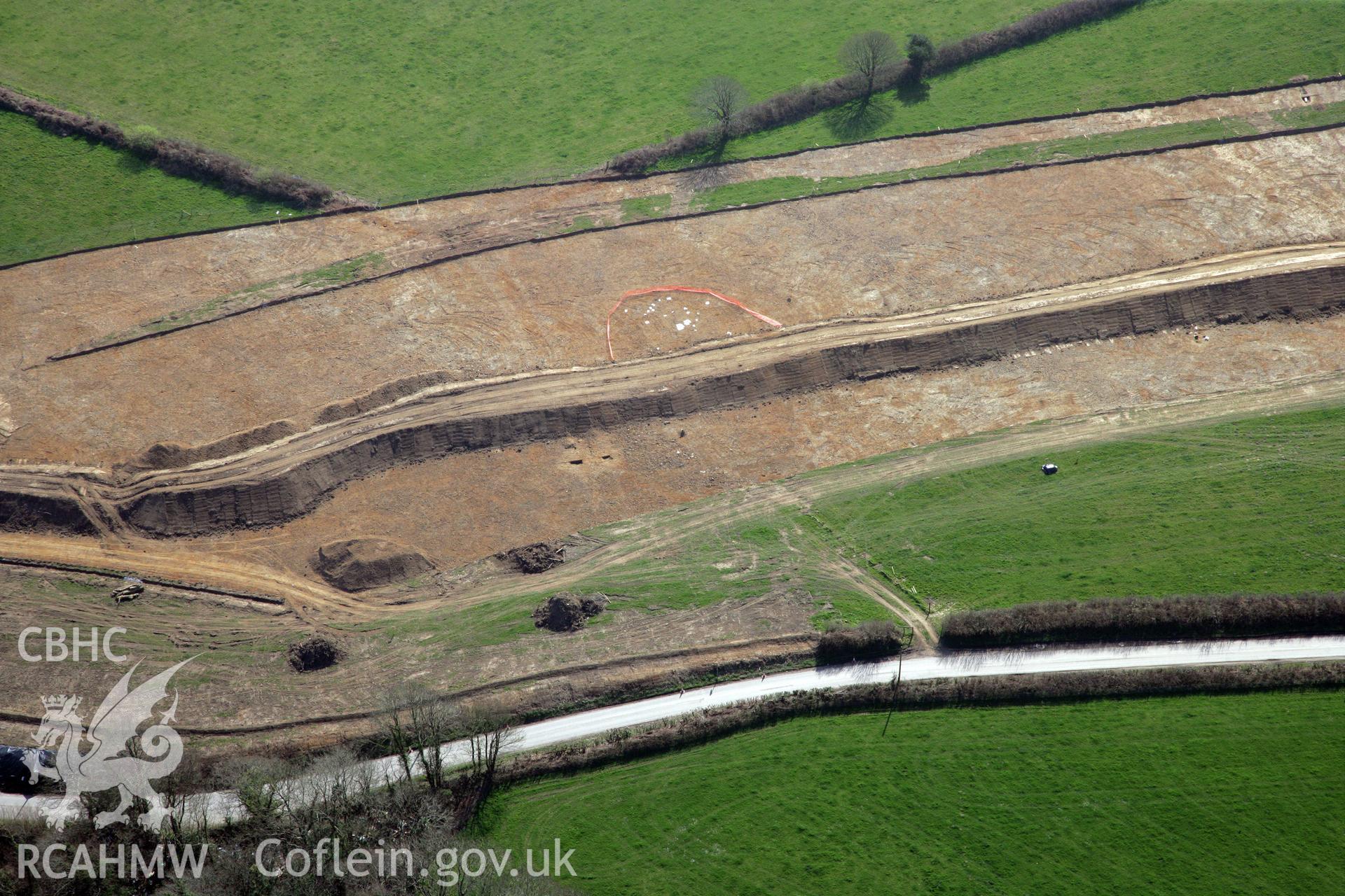 RCAHMW colour oblique photograph of A477 Bypass, at Pentrehowell. Archaeological excavations in progress. Taken by Toby Driver and Oliver Davies on 28/03/2012.