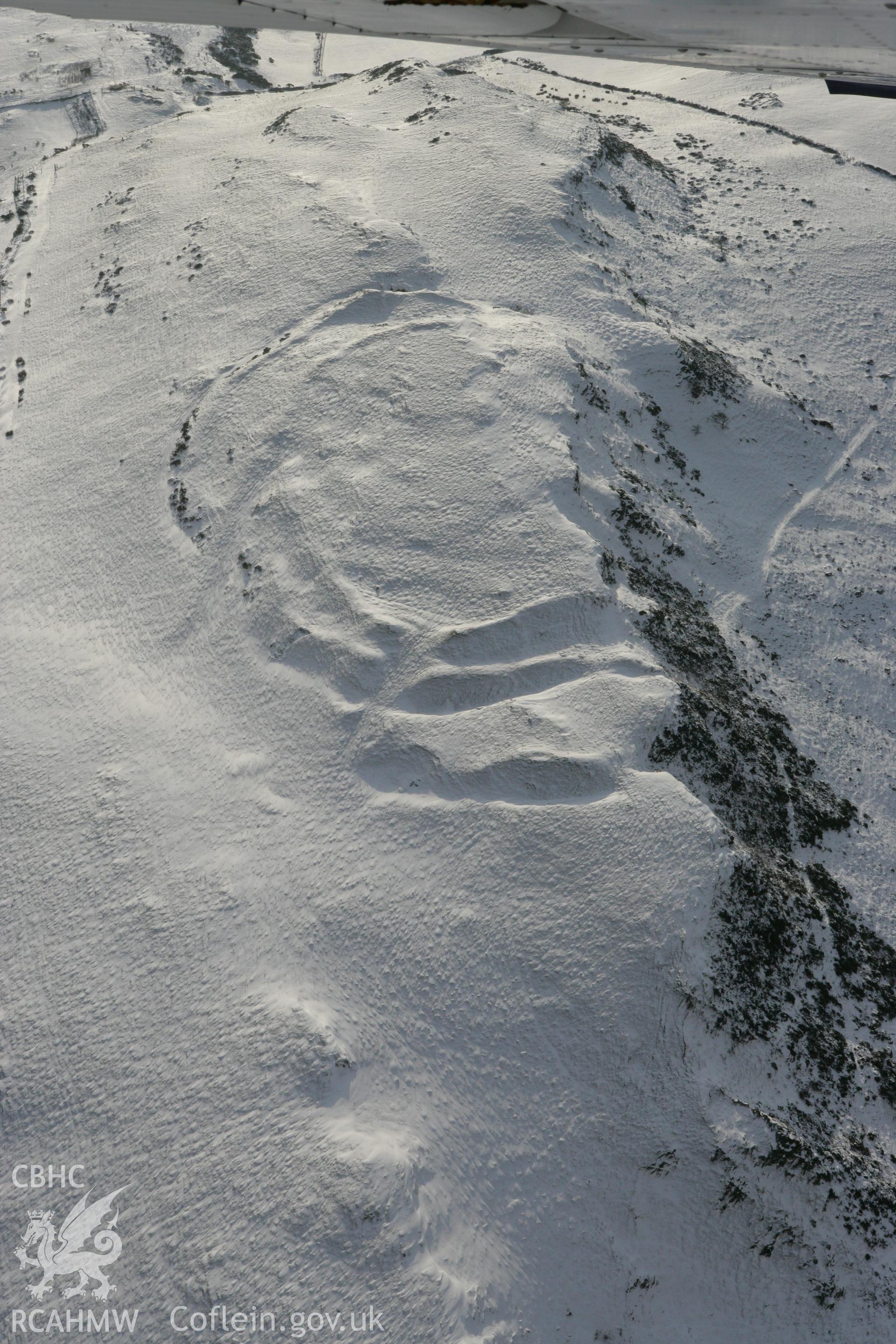 RCAHMW colour oblique photograph of Pen-y-ffrwd Llwyd hillfort. Taken by Toby Driver on 02/12/2010.