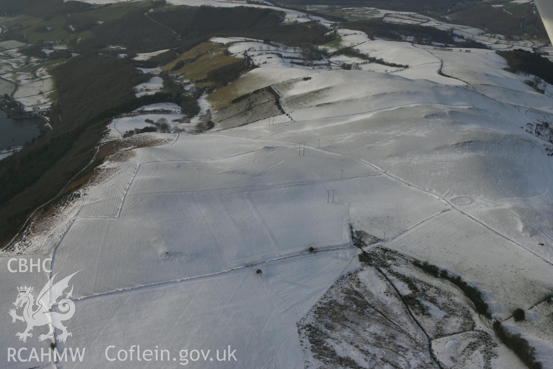 RCAHMW colour oblique photograph of Gelli round barrow. Taken by Toby Driver on 02/12/2010.