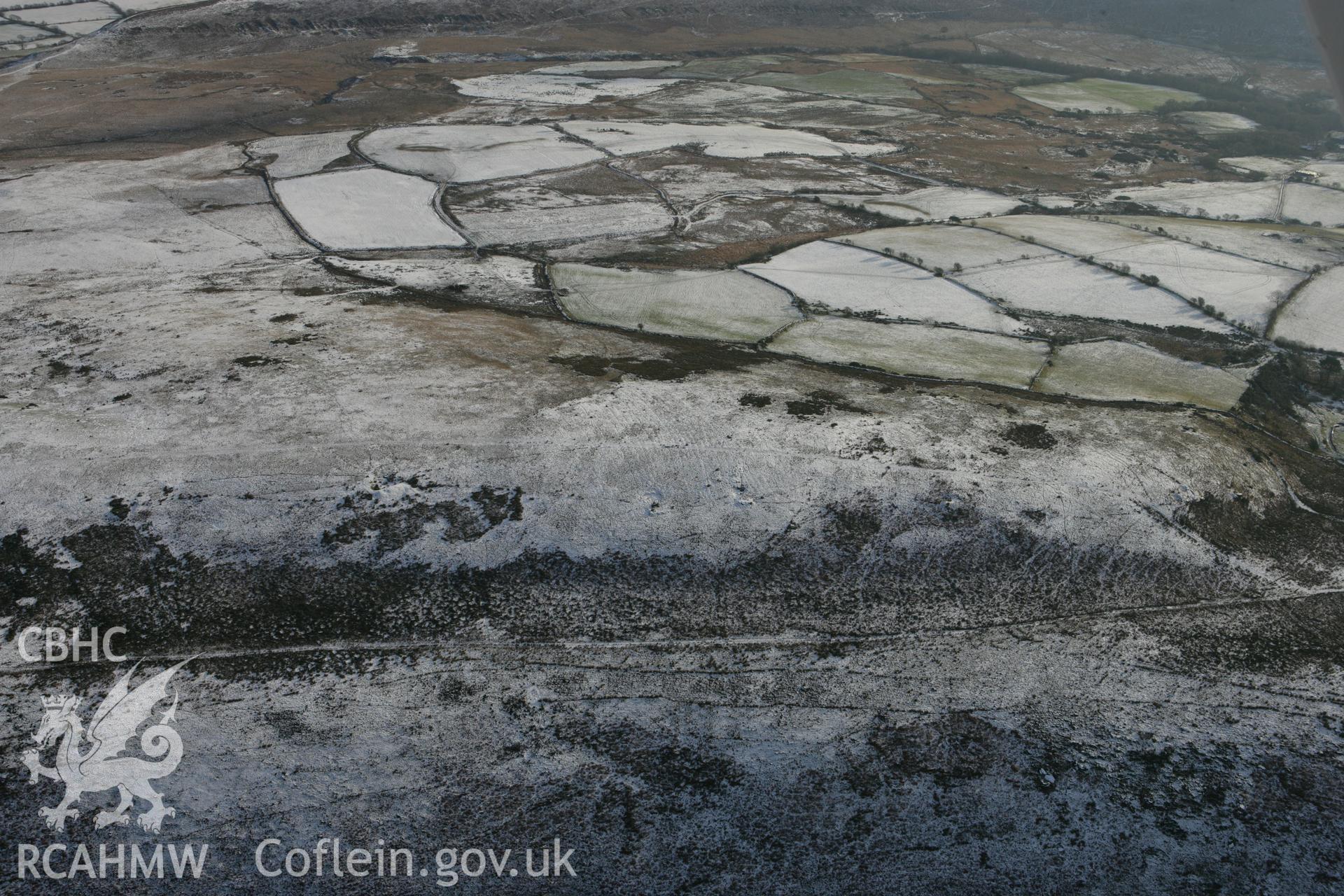 RCAHMW colour oblique photograph of Graig Fawr (west) enclosure from the north-west, with cultivation ridges. Taken by Toby Driver on 01/12/2010.