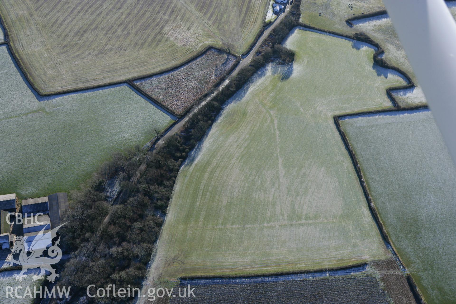 RCAHMW colour oblique photograph of St Donats, lines of former field boundaries, south of the Ffynnon-y-capel mounds. Taken by Toby Driver on 08/12/2010.