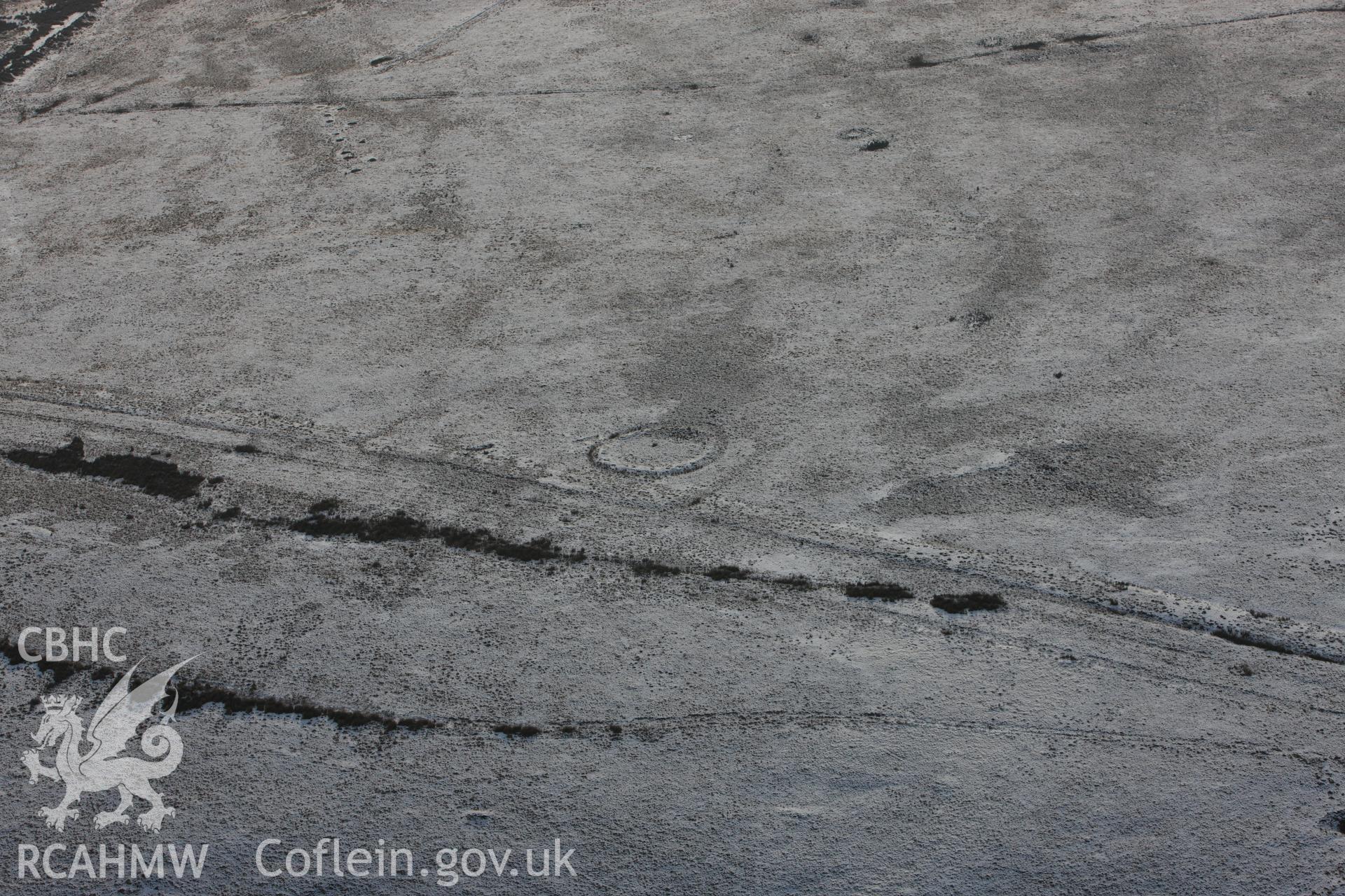 RCAHMW colour oblique photograph of ring cairn on Tor Clawdd. Taken by Toby Driver on 01/12/2010.