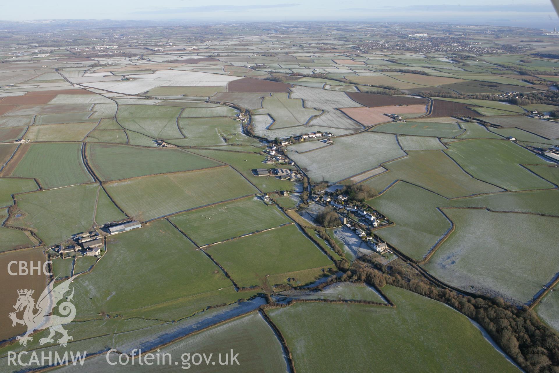 RCAHMW colour oblique photograph of Marcross, from the south-west, showing Holy Trinity Church. Taken by Toby Driver on 08/12/2010.