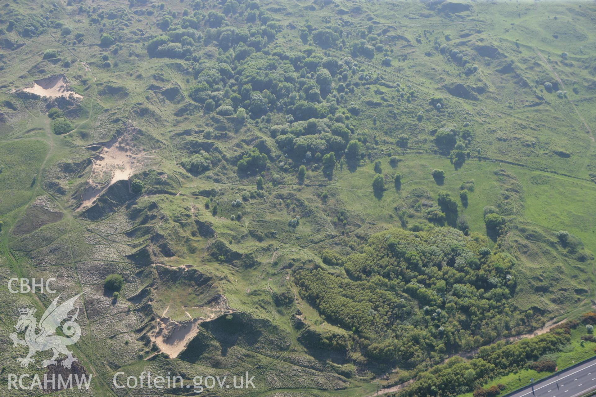 RCAHMW colour oblique photograph of Kenfig Medieval Borough. Taken by Toby Driver on 24/05/2010.