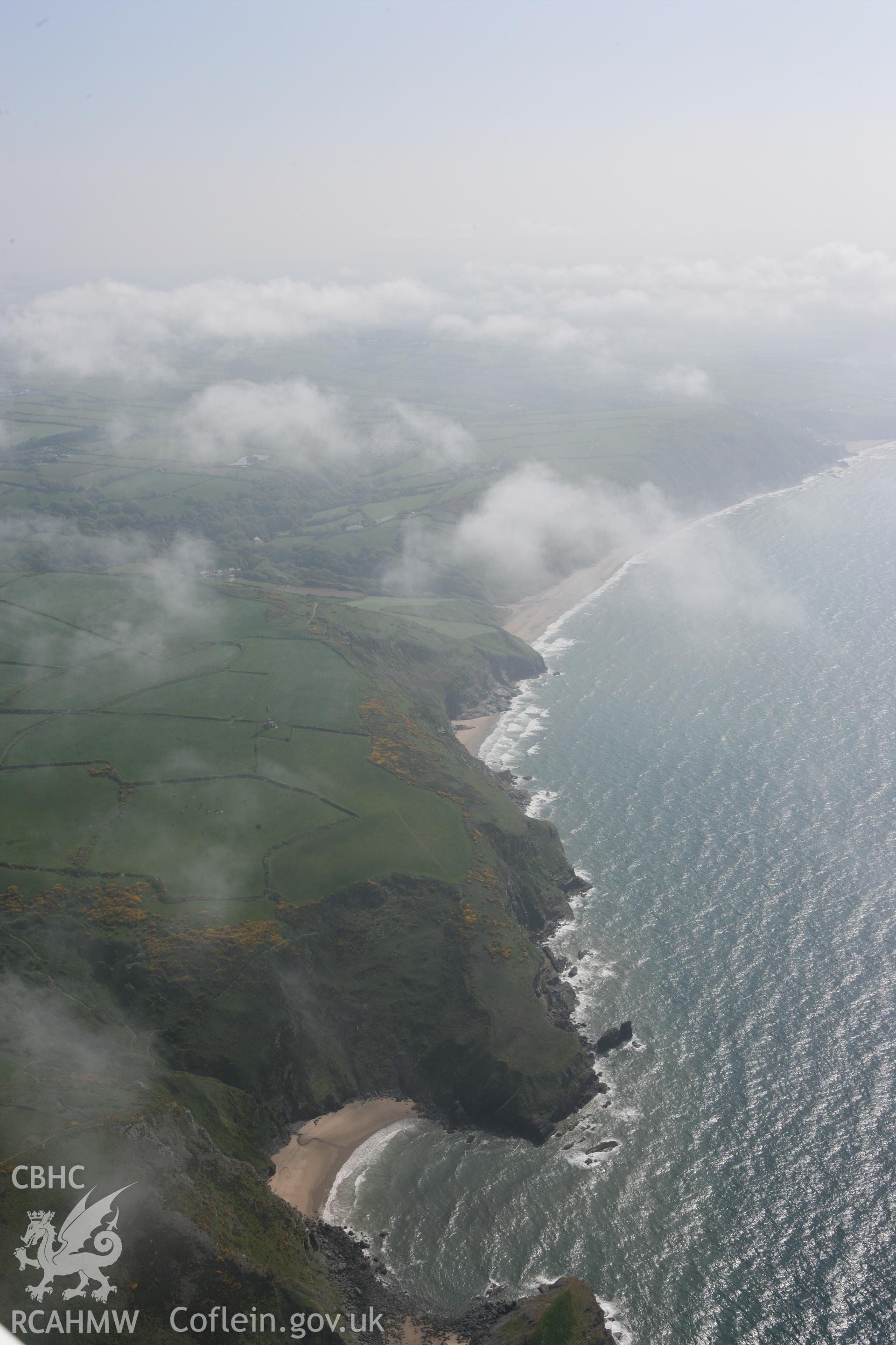 RCAHMW colour oblique photograph of Beach below Castell Bach. Taken by Toby Driver on 25/05/2010.