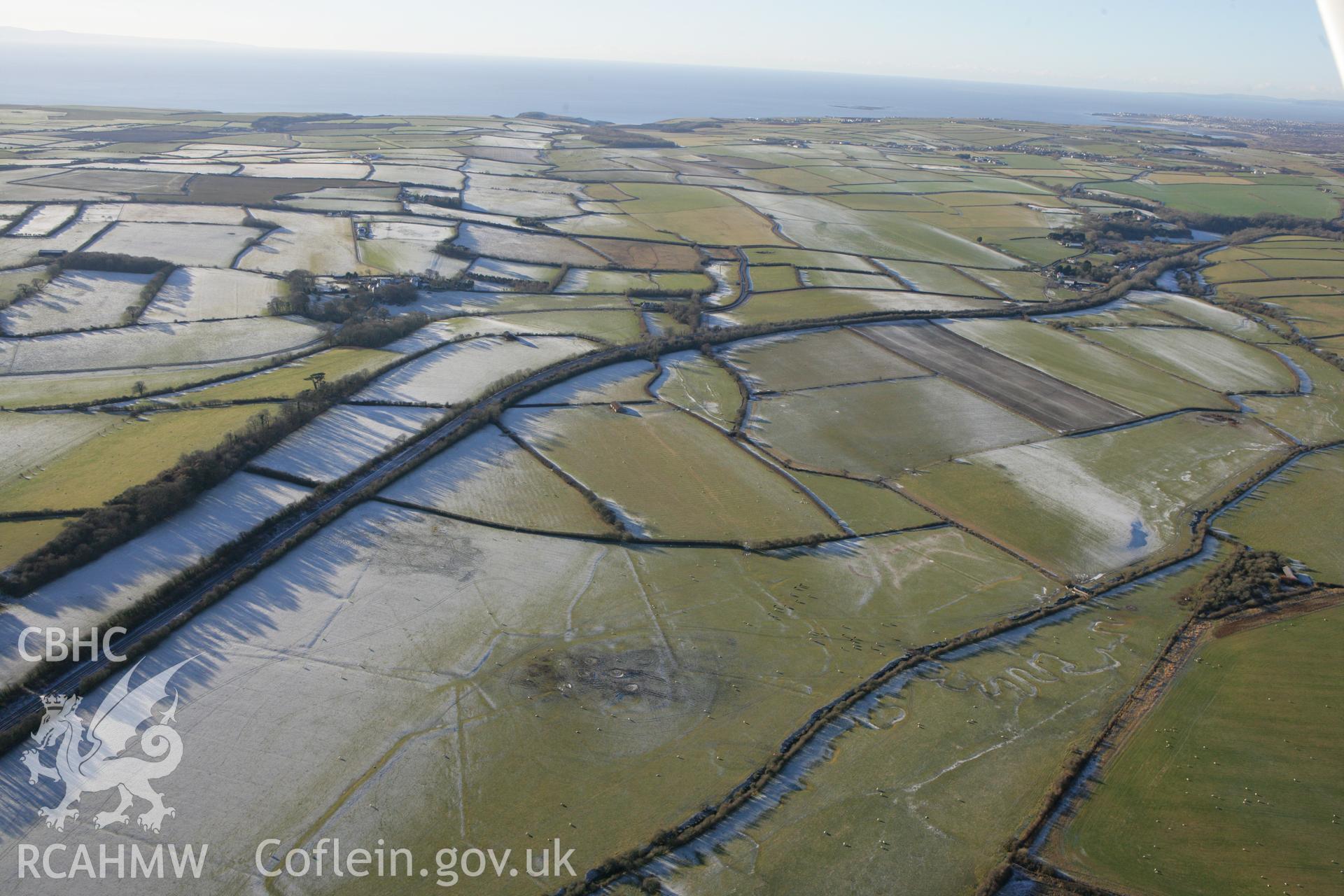 RCAHMW colour oblique photograph of Clemenston, showing earthworks of former field boundaries. Taken by Toby Driver on 08/12/2010.