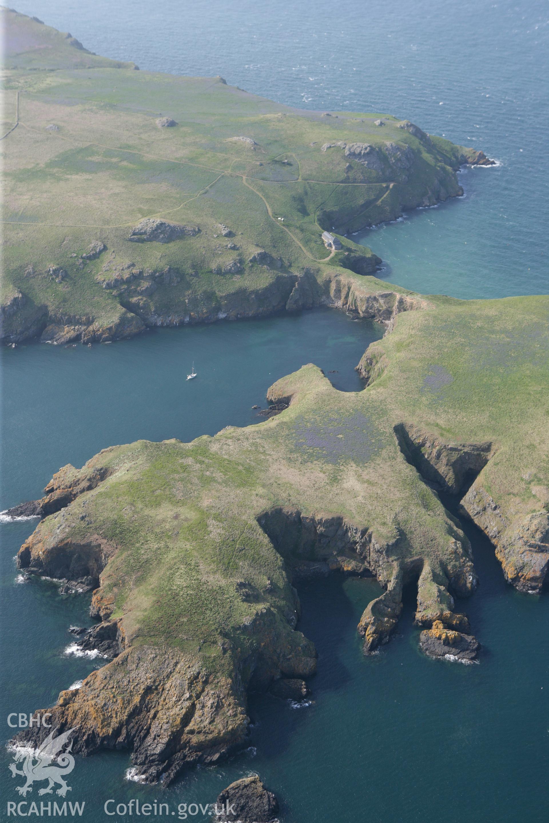 RCAHMW colour oblique photograph of South Castle, Skomer Island, The Neck promontory fort, SAM. Taken by Toby Driver on 25/05/2010.