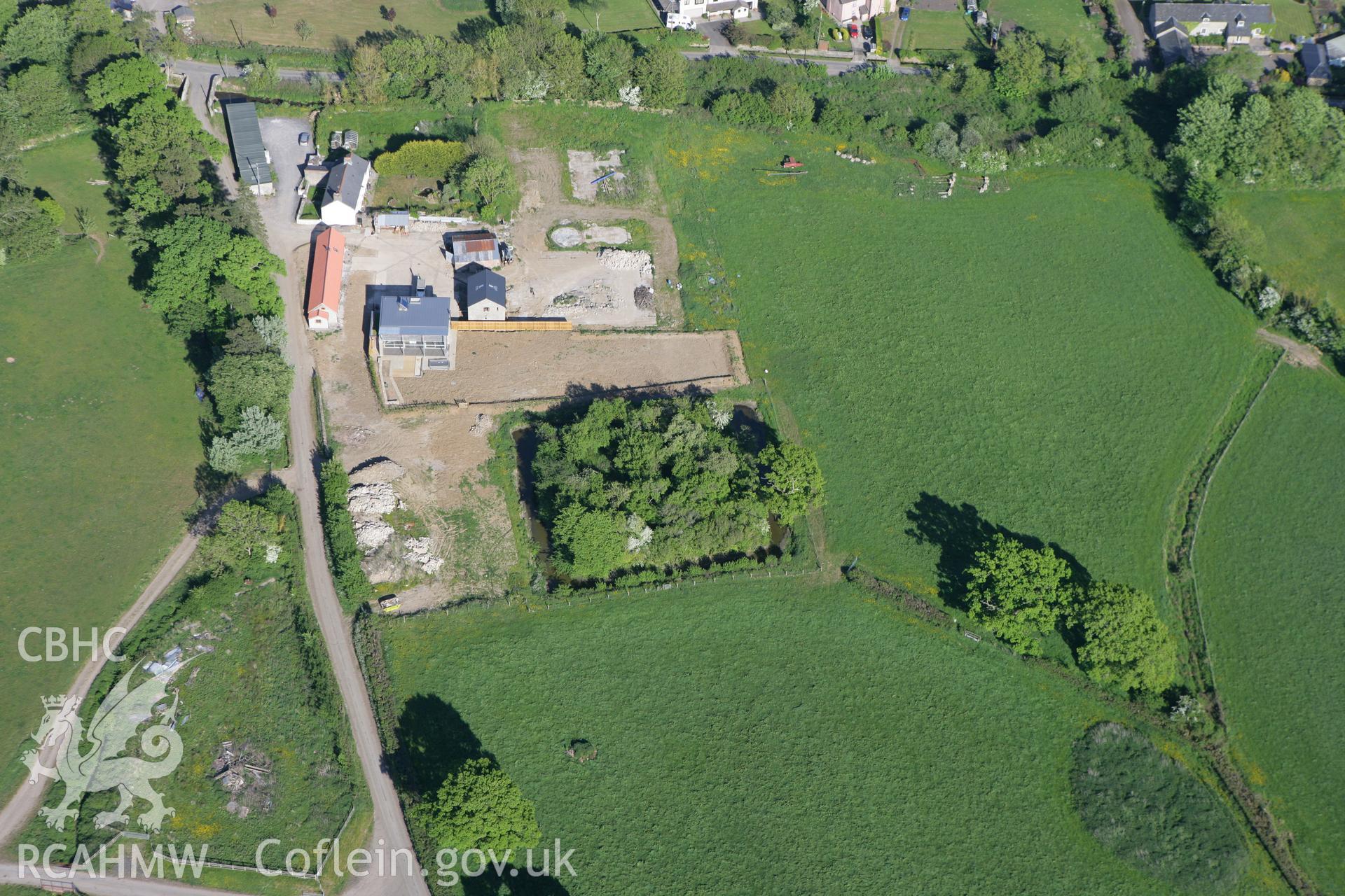 RCAHMW colour oblique photograph of Dog Hill Moat (Worleton). Taken by Toby Driver on 24/05/2010.