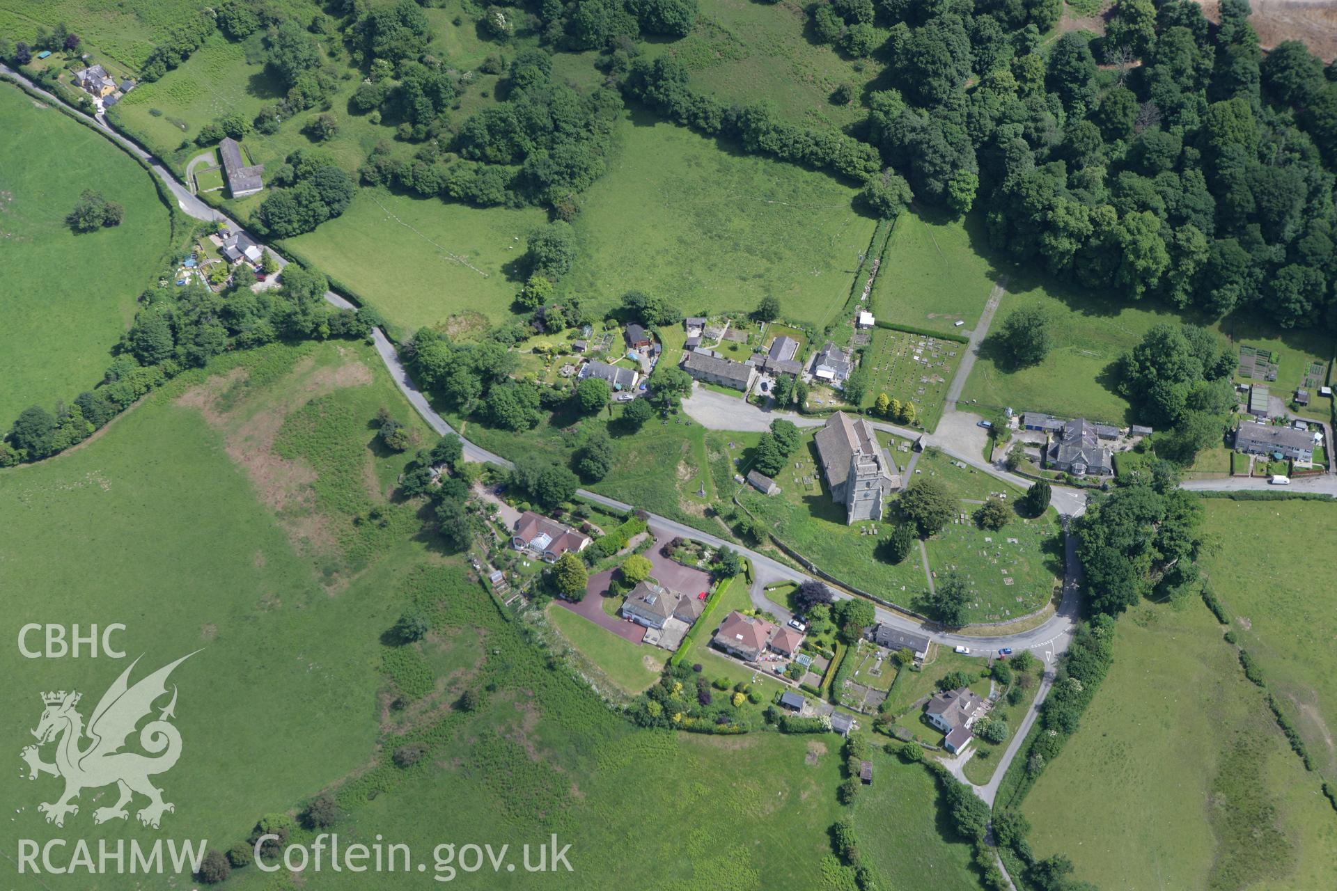 RCAHMW colour oblique photograph of Old Radnor, showing Old Radnor Castle and St Stephens Church. Taken by Toby Driver on 21/06/2010.