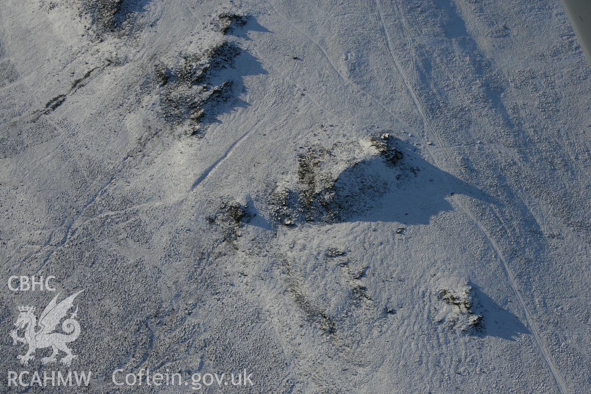 RCAHMW colour oblique photograph of Carn Menyn outcrops. Taken by Toby Driver on 01/12/2010.