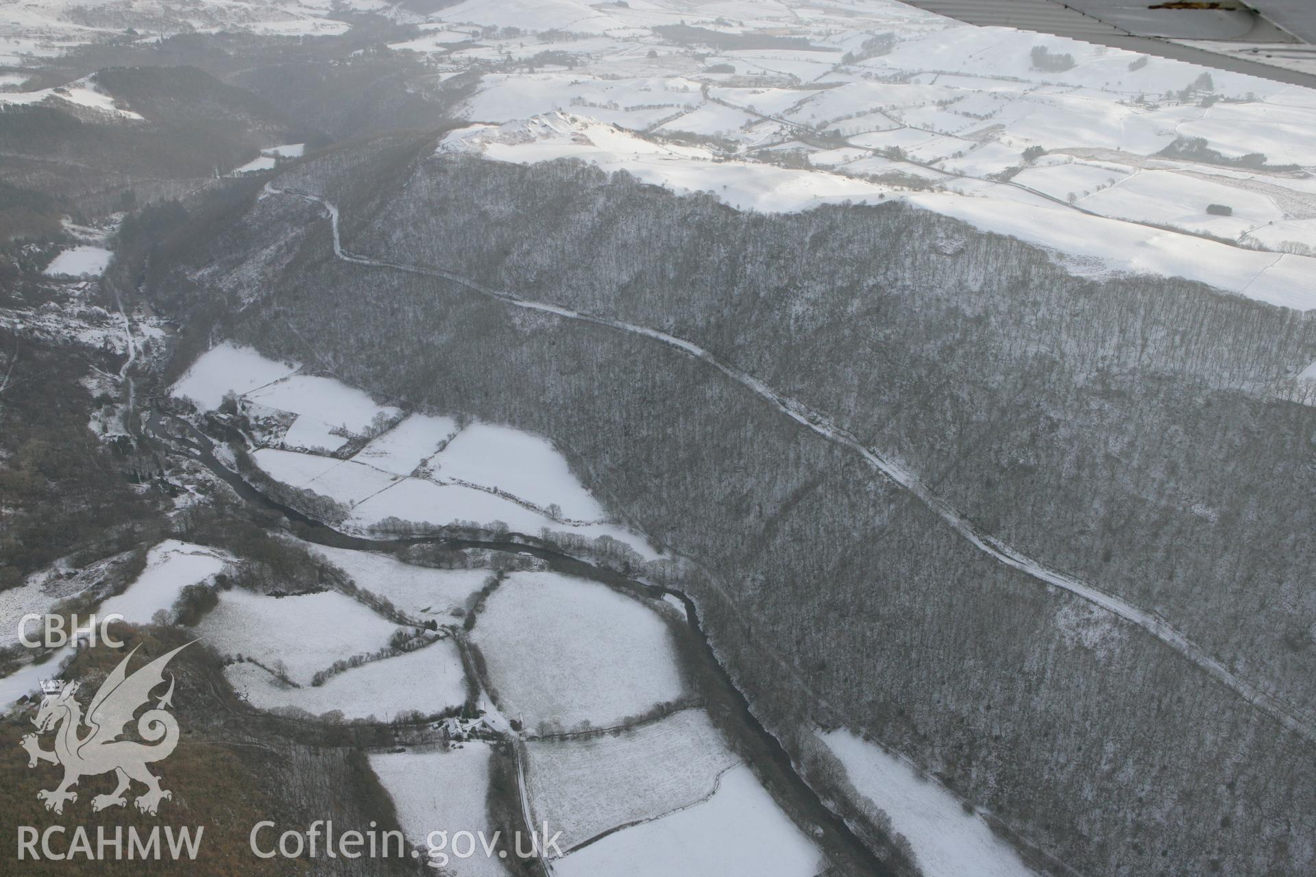 RCAHMW colour oblique photograph of Rheidol Valley looking south-east towards Devils Bridge, showing the Vale of Rheidol Railway. Taken by Toby Driver on 02/12/2010.