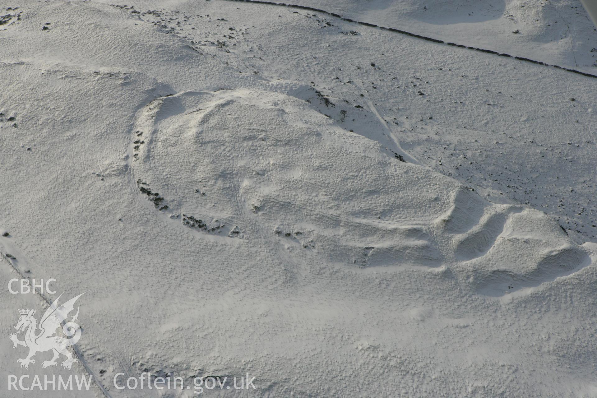 RCAHMW colour oblique photograph of Pen-y-ffrwd Llwyd hillfort. Taken by Toby Driver on 02/12/2010.