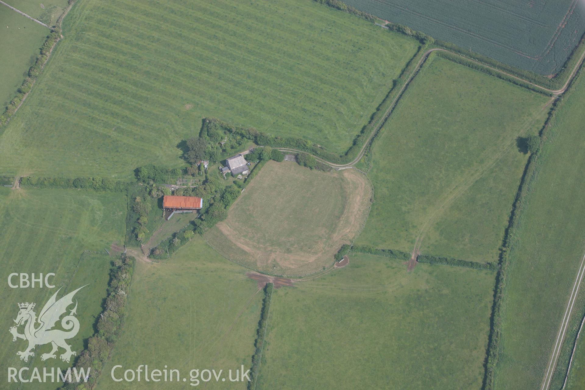 RCAHMW colour oblique photograph of Castell Bryn Gwyn, Neolithic henge and later ringwork. Taken by Toby Driver on 10/06/2010.